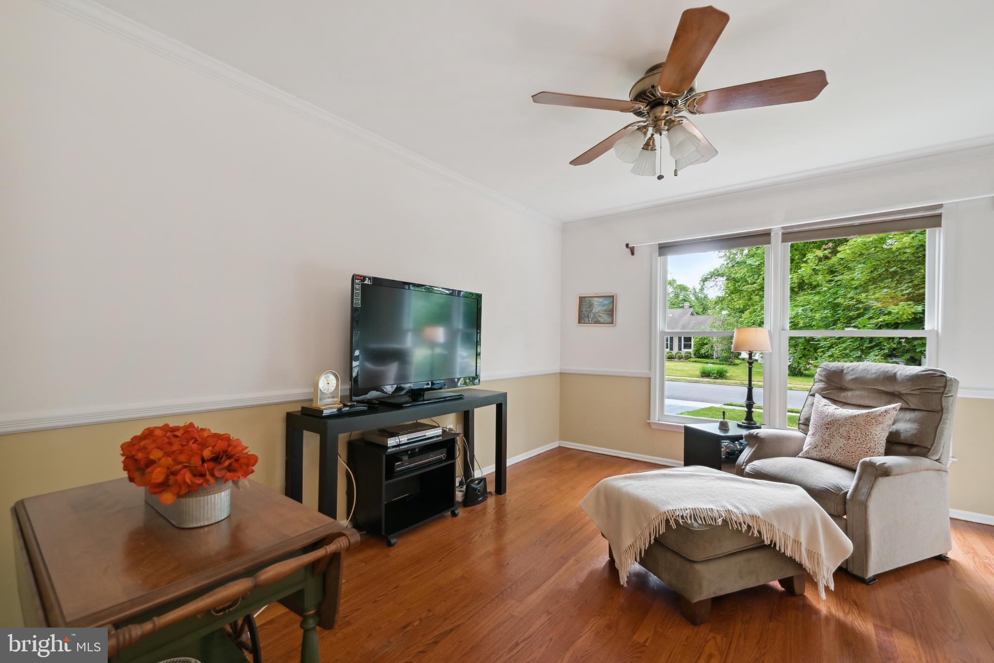 16 Fieldston Road West Windsor, NJ 08550 - Photo 8 of 34 a living room with furniture and a flat screen tv
