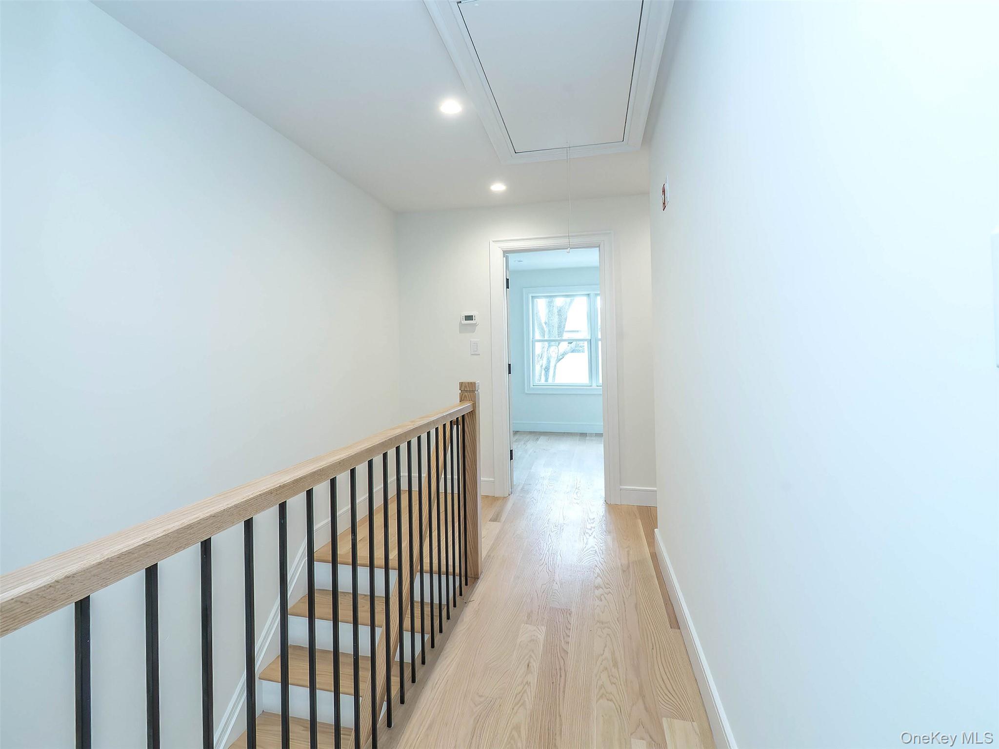35 B Dunwood Road Port Washington, NY 11050 - Photo 13 of 35 a view of a hallway with wooden floor