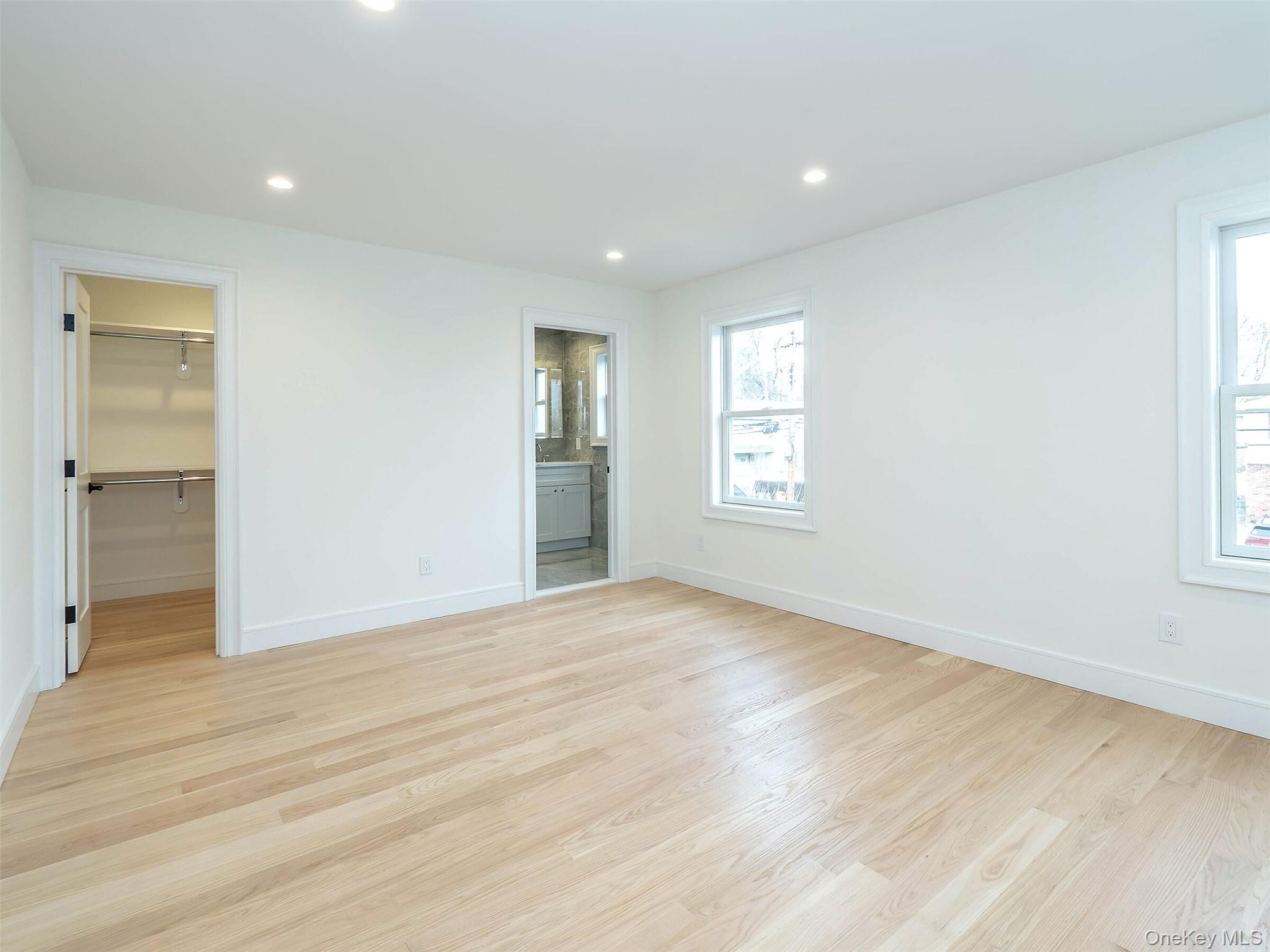 35 B Dunwood Road Port Washington, NY 11050 - Photo 16 of 35 wooden floor in an empty room with a window