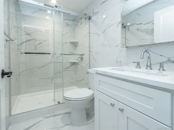 a utility room with a sink washer and dryer