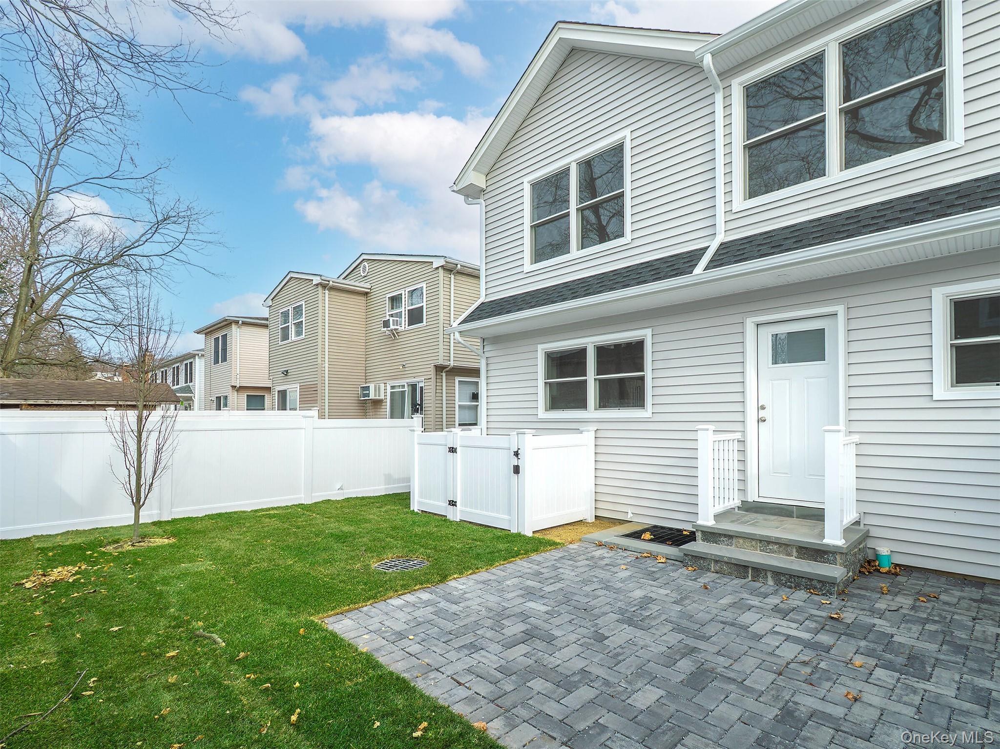 35 B Dunwood Road Port Washington, NY 11050 - Photo 32 of 35 a view of house with a yard