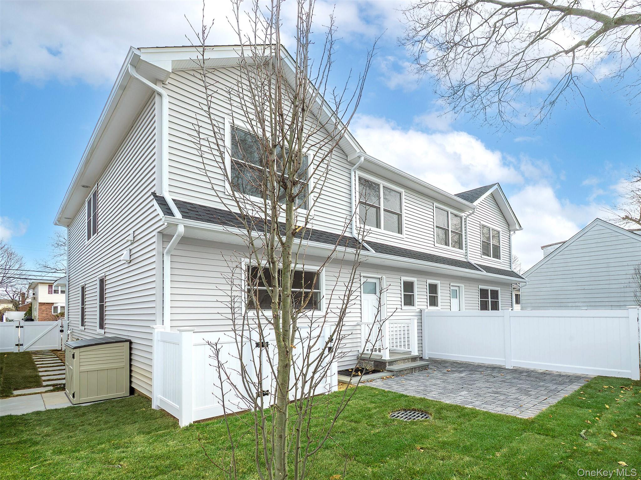 35 B Dunwood Road Port Washington, NY 11050 - Photo 34 of 35 a front view of house with yard
