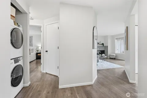 a view of a hallway with washer and dryer