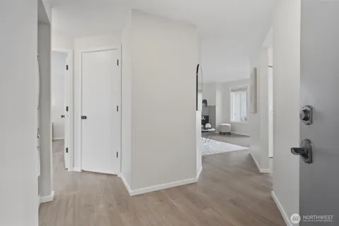a view of a hallway with washer and dryer