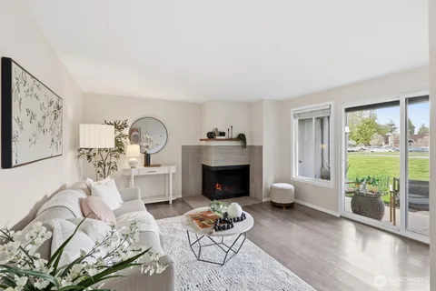 a living room with furniture fireplace and flat screen tv