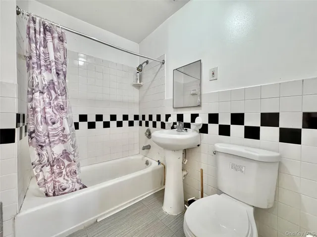 a bathroom with a sink a toilet and a bathtub