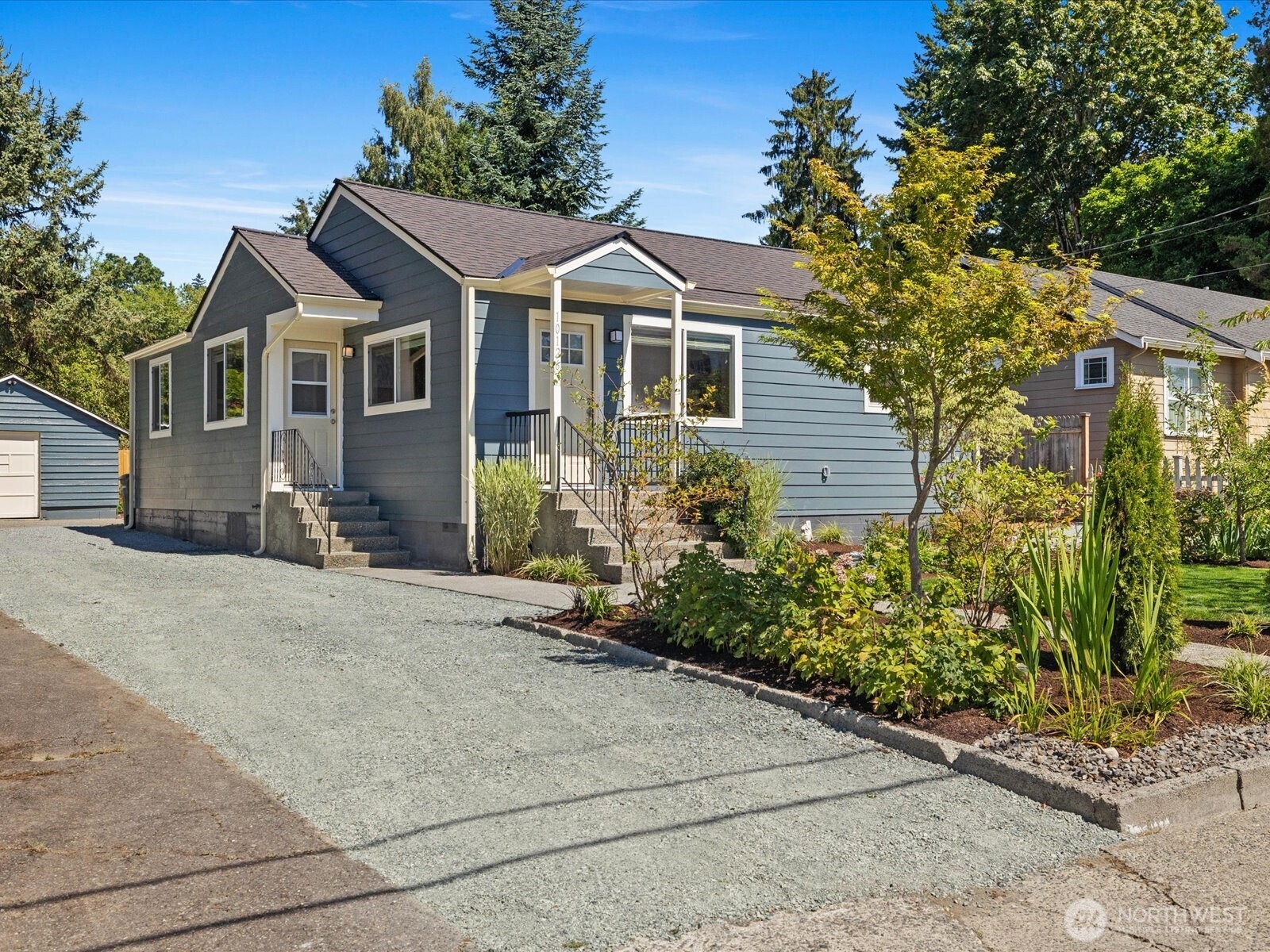 10126 Northeast 186th Street Bothell, WA 98011 - Photo 1 of 40 a front view of a house with a yard and garage