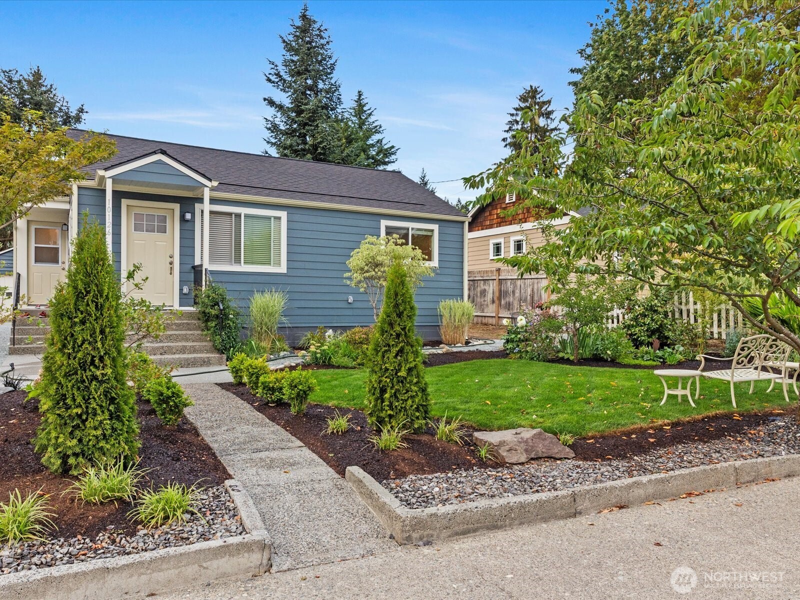 10126 Northeast 186th Street Bothell, WA 98011 - Photo 16 of 40 a front view of a house with garden