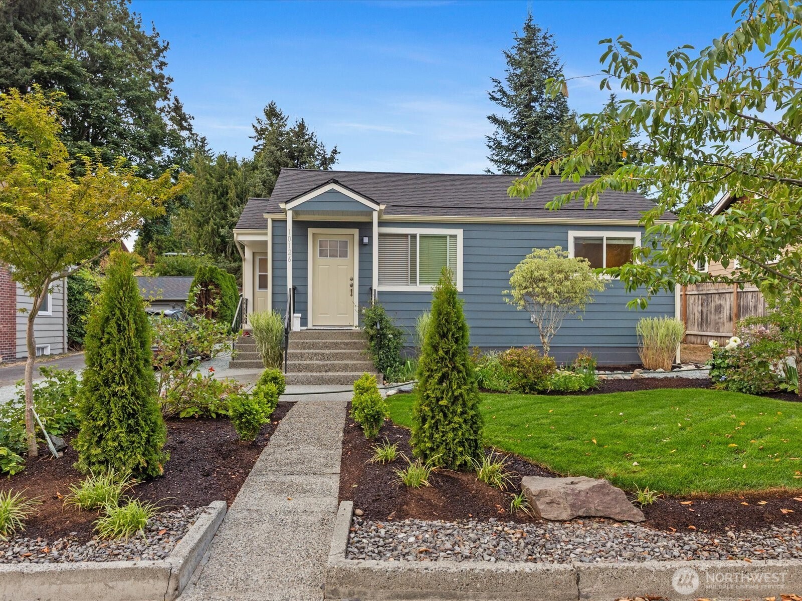10126 Northeast 186th Street Bothell, WA 98011 - Photo 18 of 40 a front view of a house with a yard