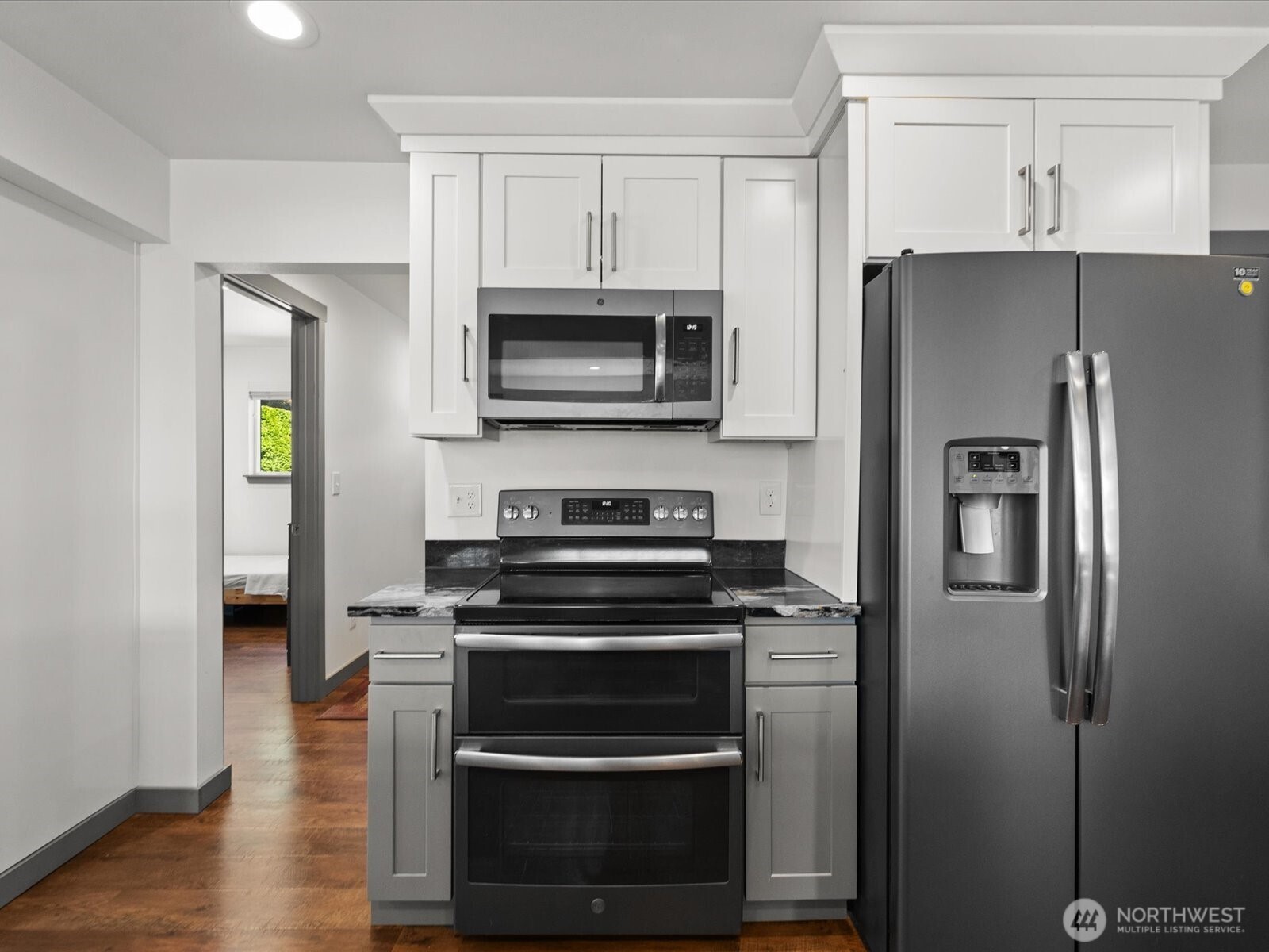 10126 Northeast 186th Street Bothell, WA 98011 - Photo 23 of 40 a kitchen with a refrigerator stove and microwave