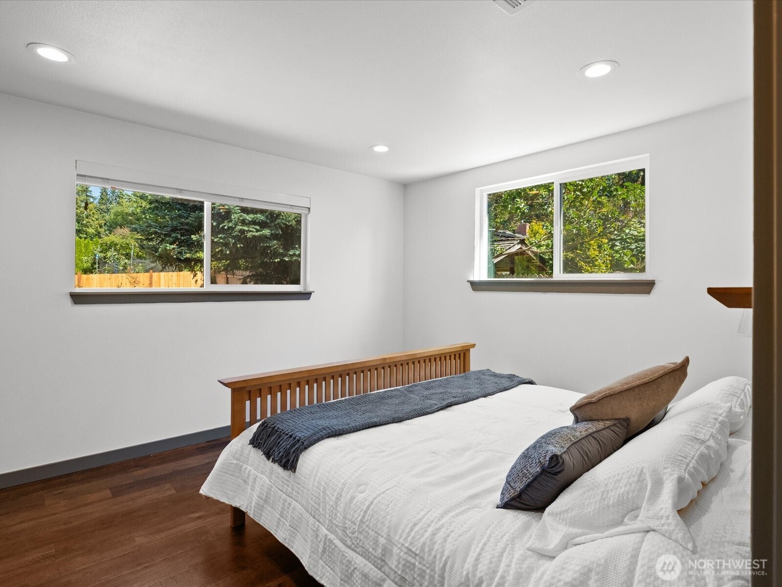 10126 Northeast 186th Street Bothell, WA 98011 - Photo 27 of 40 a bedroom with a bed and a window