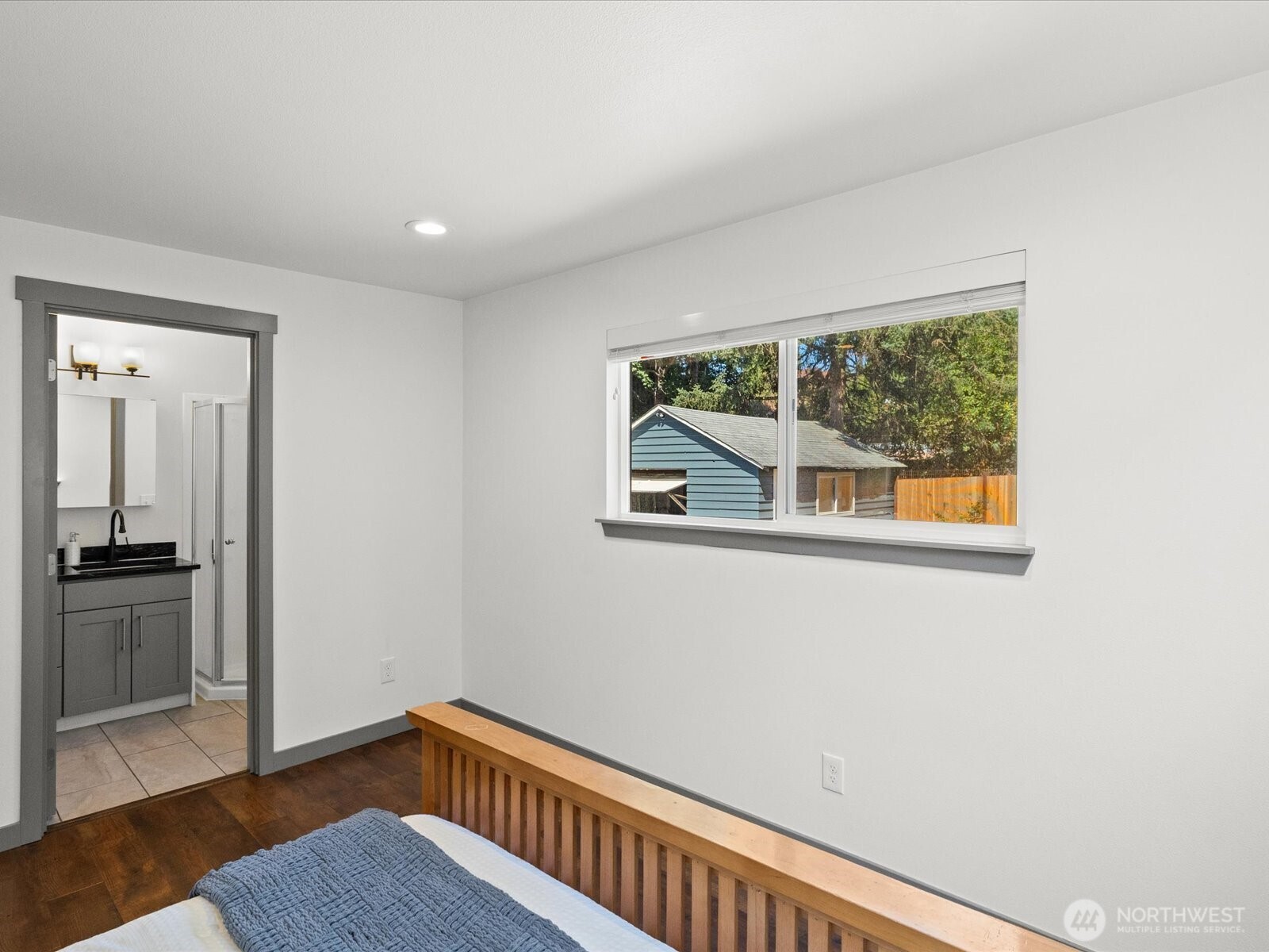 10126 Northeast 186th Street Bothell, WA 98011 - Photo 29 of 40 a view of an empty room with wooden floor and a window