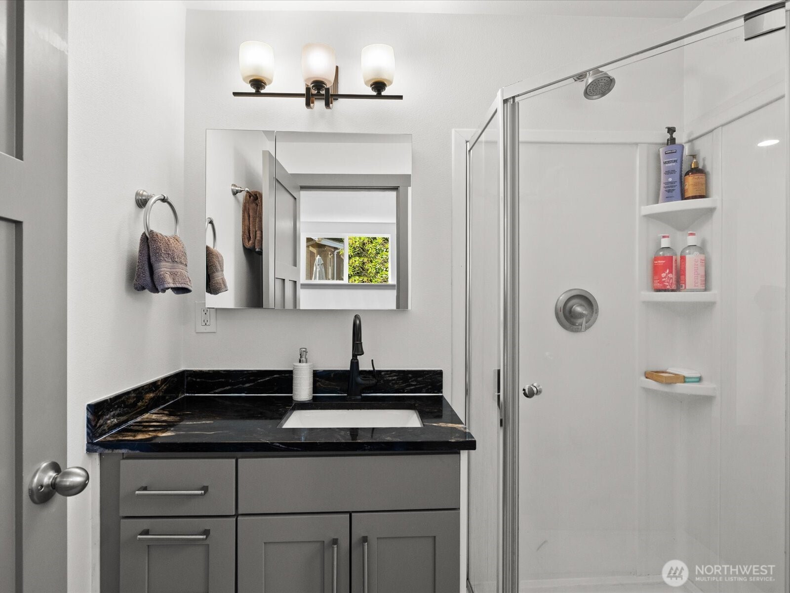 10126 Northeast 186th Street Bothell, WA 98011 - Photo 30 of 40 a bathroom with a sink and a mirror