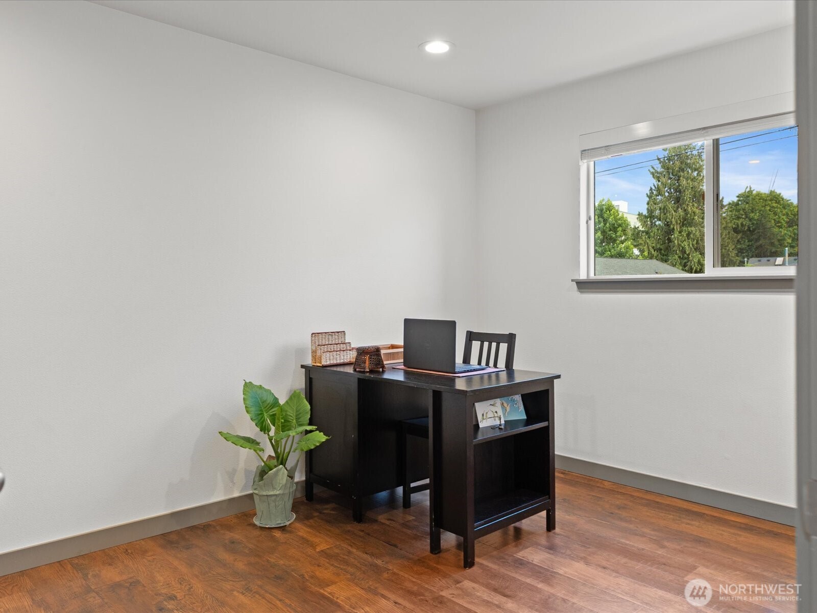 10126 Northeast 186th Street Bothell, WA 98011 - Photo 33 of 40 a view of workspace with wooden floor lounge chair and windows