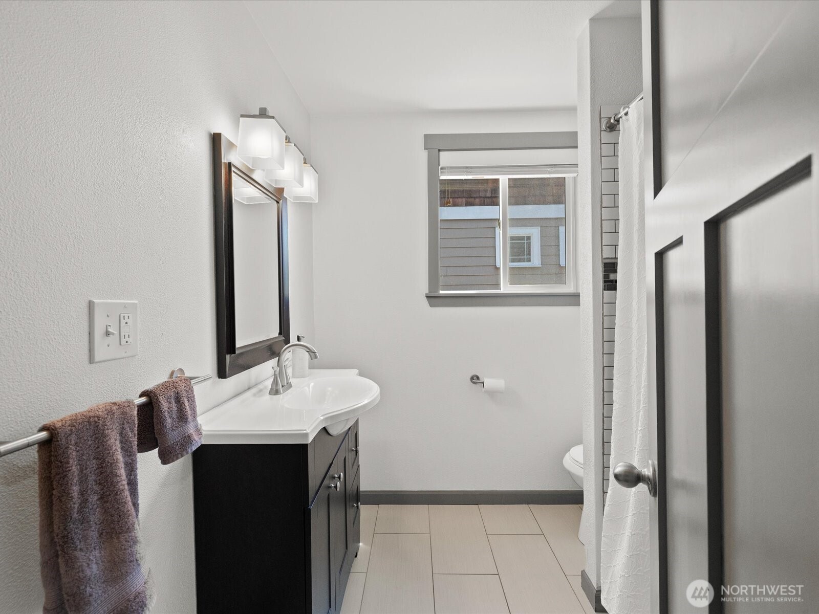 10126 Northeast 186th Street Bothell, WA 98011 - Photo 35 of 40 a bathroom with a sink and a mirror