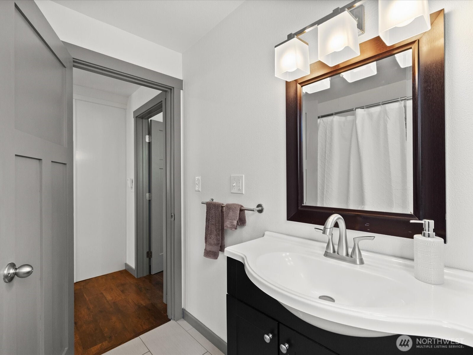 10126 Northeast 186th Street Bothell, WA 98011 - Photo 36 of 40 a bathroom with a sink and a mirror