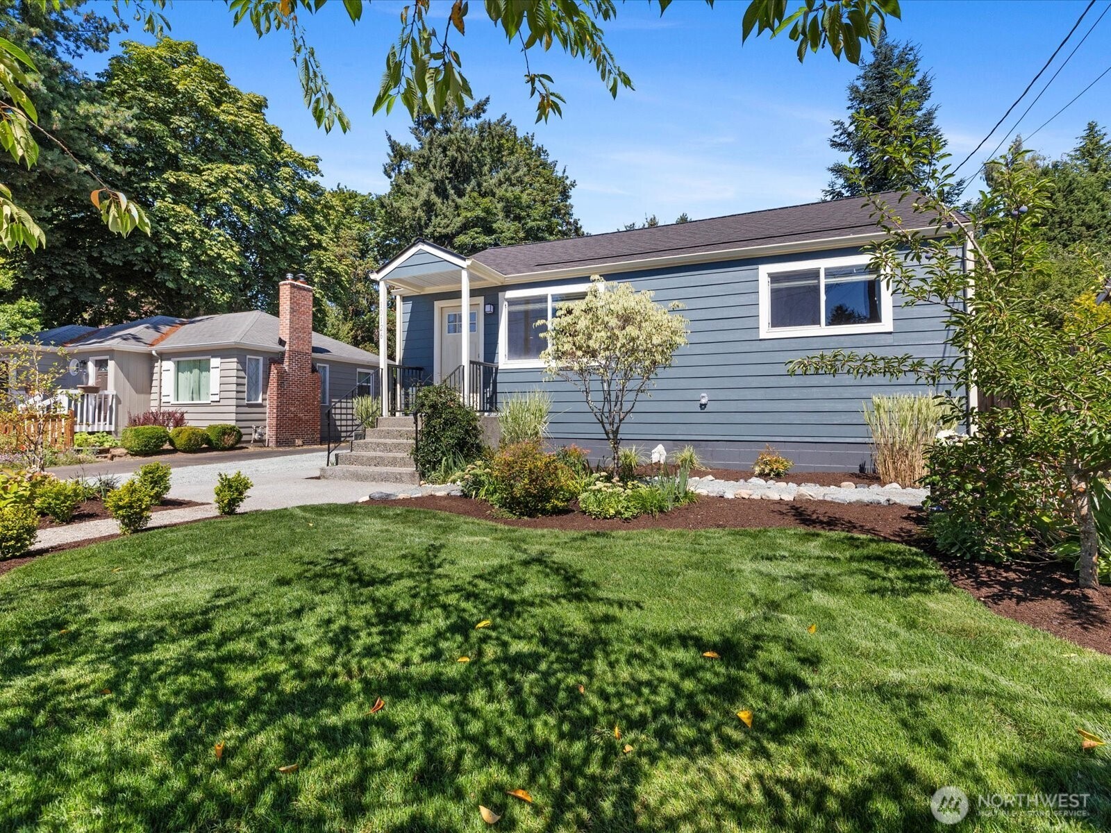 10126 Northeast 186th Street Bothell, WA 98011 - Photo 4 of 40 a front view of a house with garden