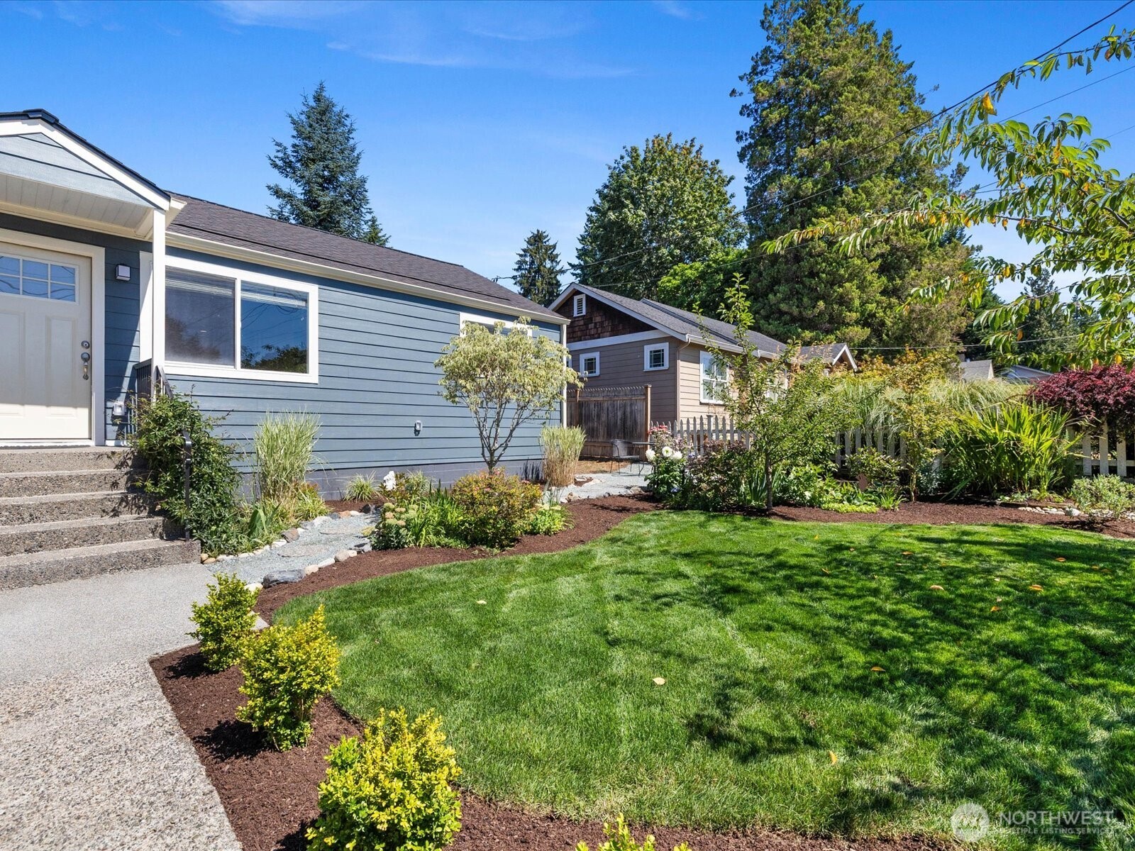 10126 Northeast 186th Street Bothell, WA 98011 - Photo 5 of 40 a front view of house with yard and green space