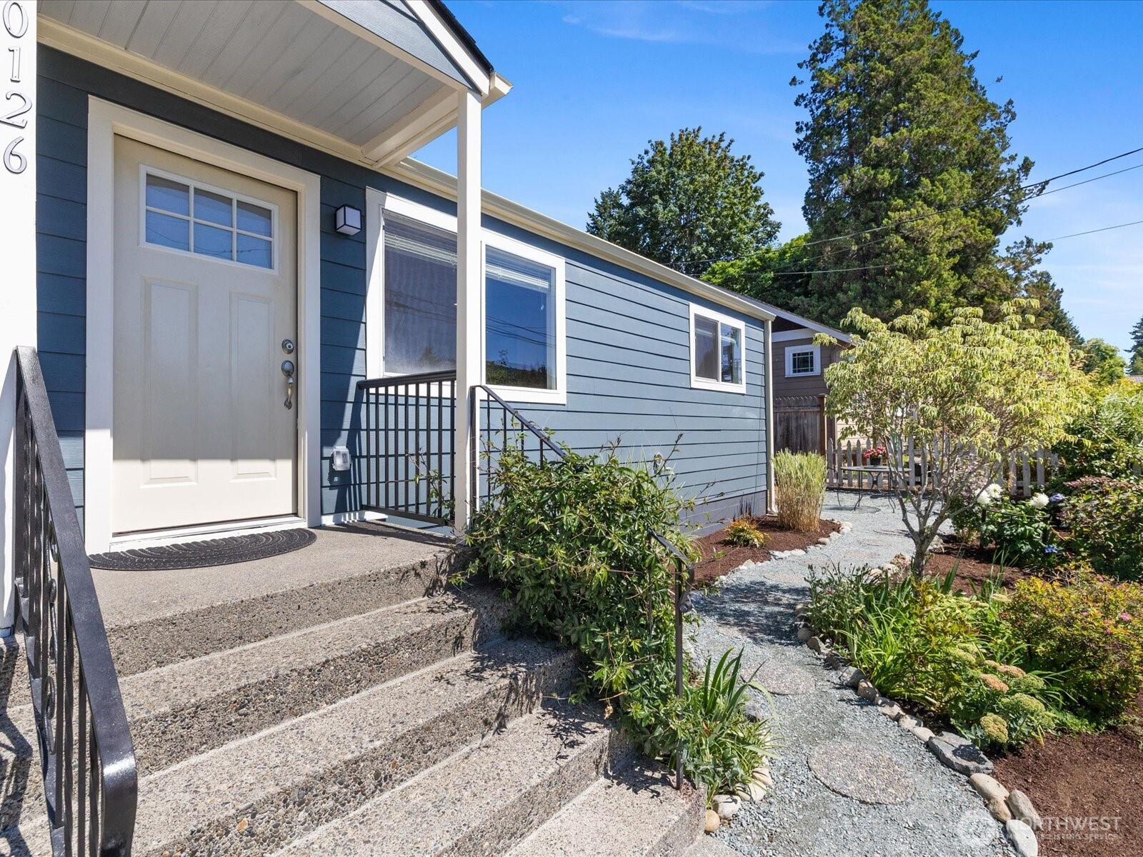 10126 Northeast 186th Street Bothell, WA 98011 - Photo 6 of 40 a front view of a house with garden