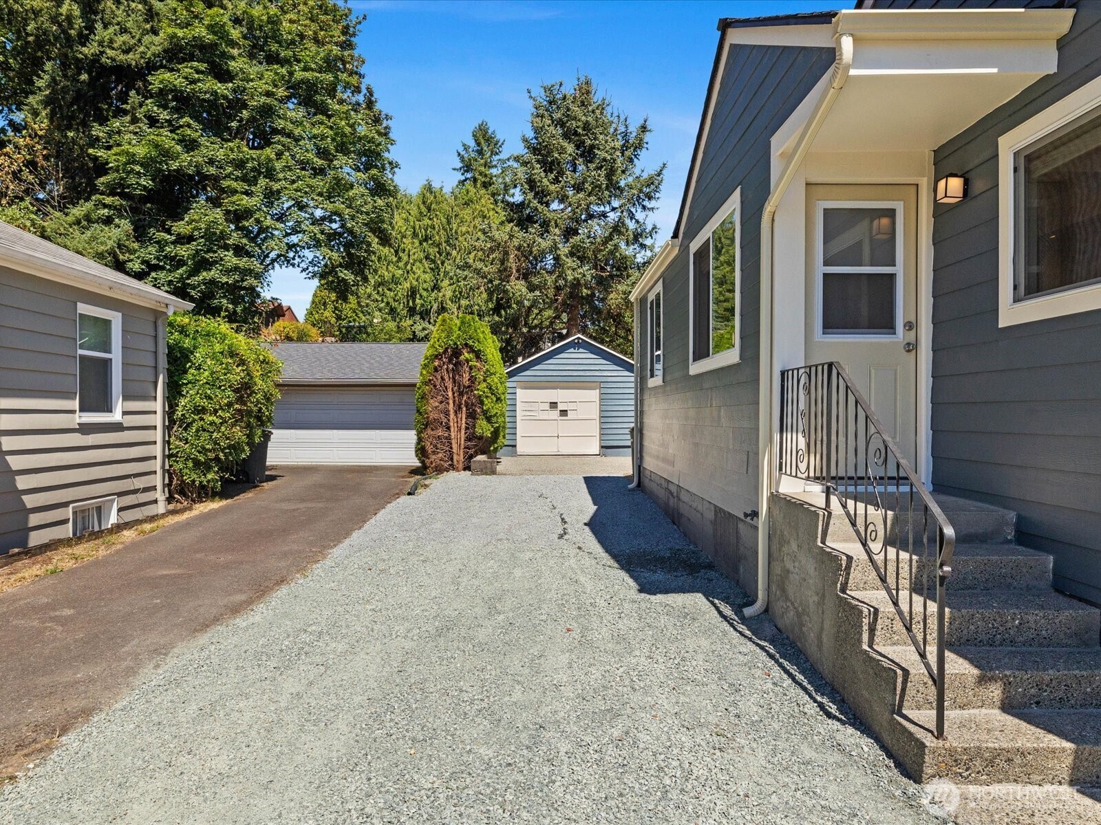 10126 Northeast 186th Street Bothell, WA 98011 - Photo 8 of 40 a front view of a house with a yard and garage