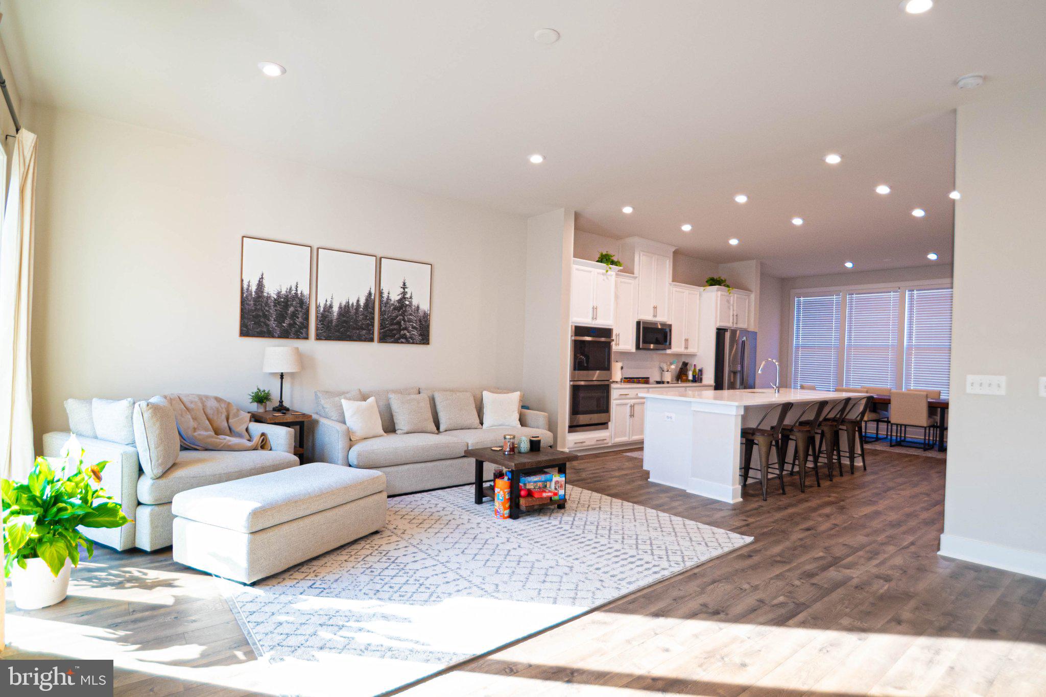 2453 Liberty Loop Herndon, VA 20171 - Photo 12 of 52 a living room with furniture and kitchen view