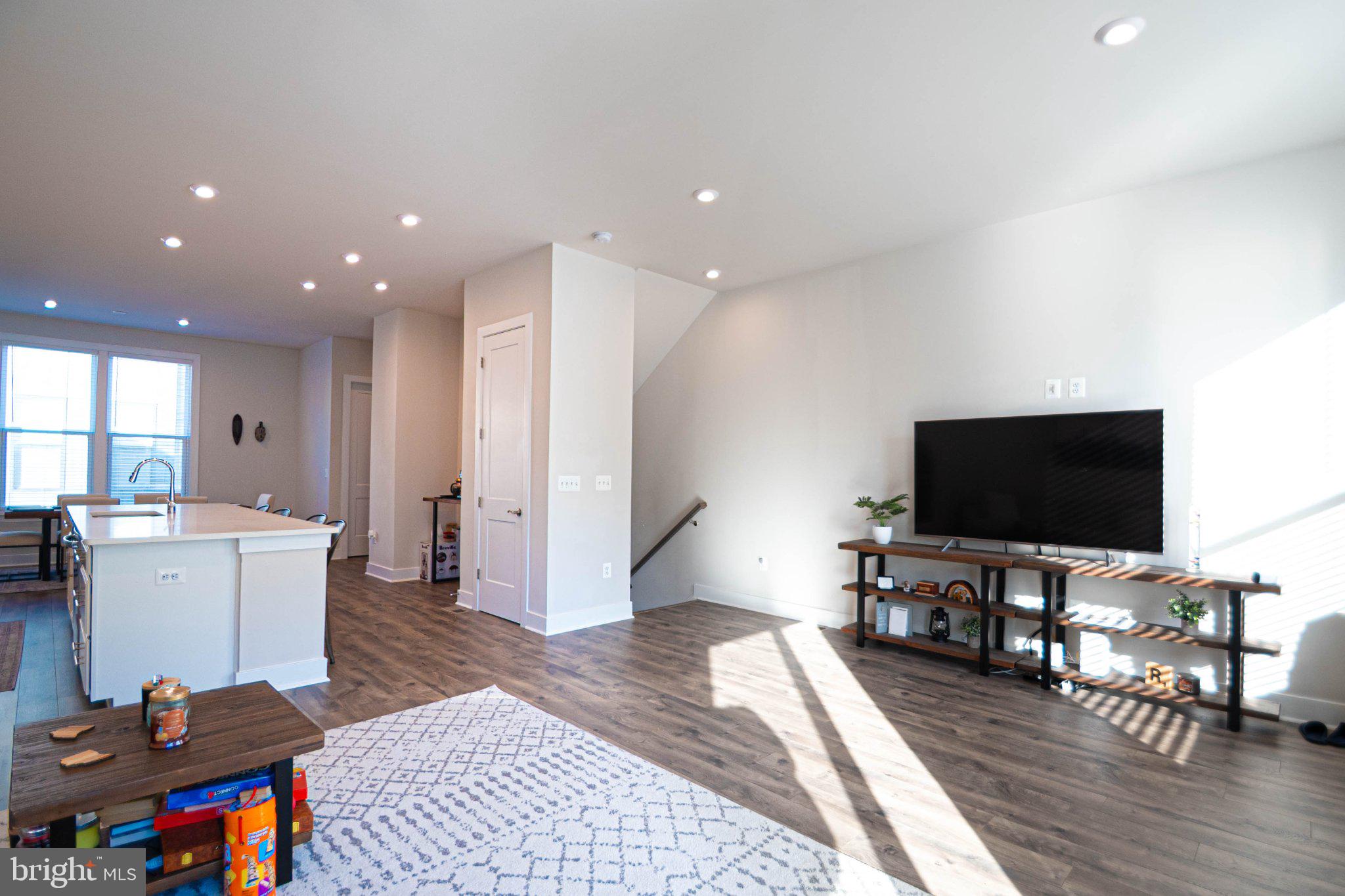 2453 Liberty Loop Herndon, VA 20171 - Photo 13 of 52 a living room with furniture and a flat screen tv