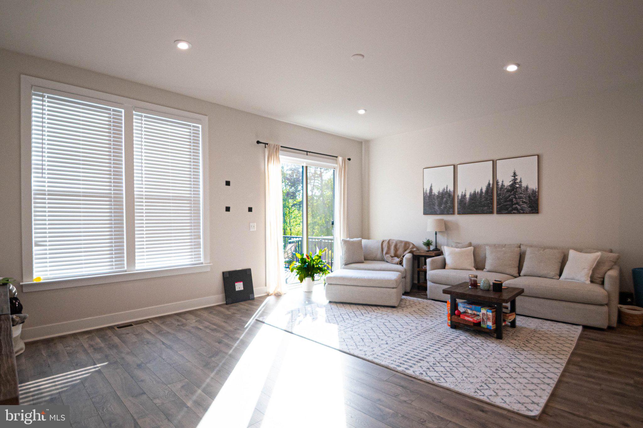 2453 Liberty Loop Herndon, VA 20171 - Photo 14 of 52 a living room with furniture and a large window