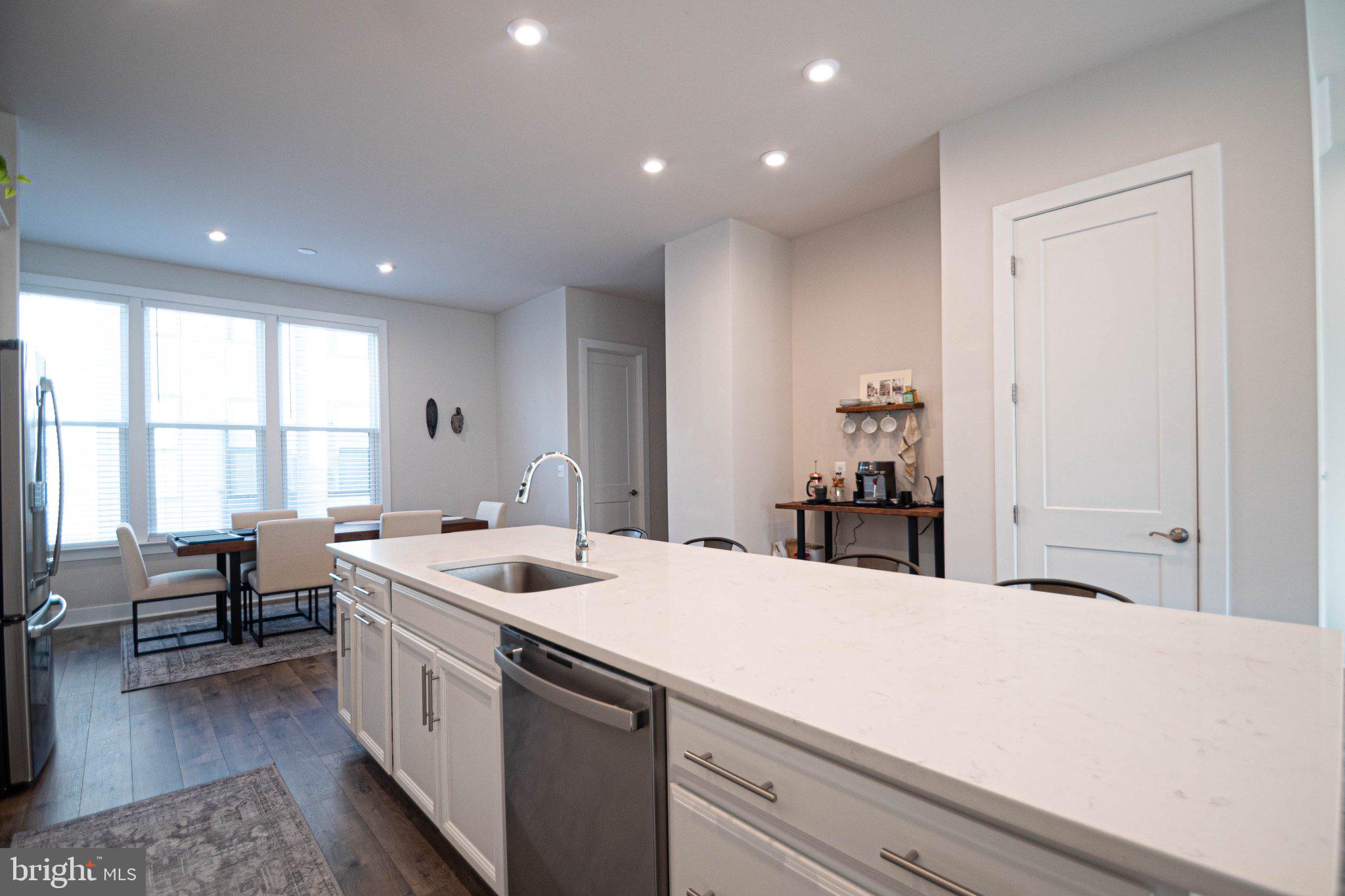 2453 Liberty Loop Herndon, VA 20171 - Photo 15 of 52 a room with a sink a table and chairs