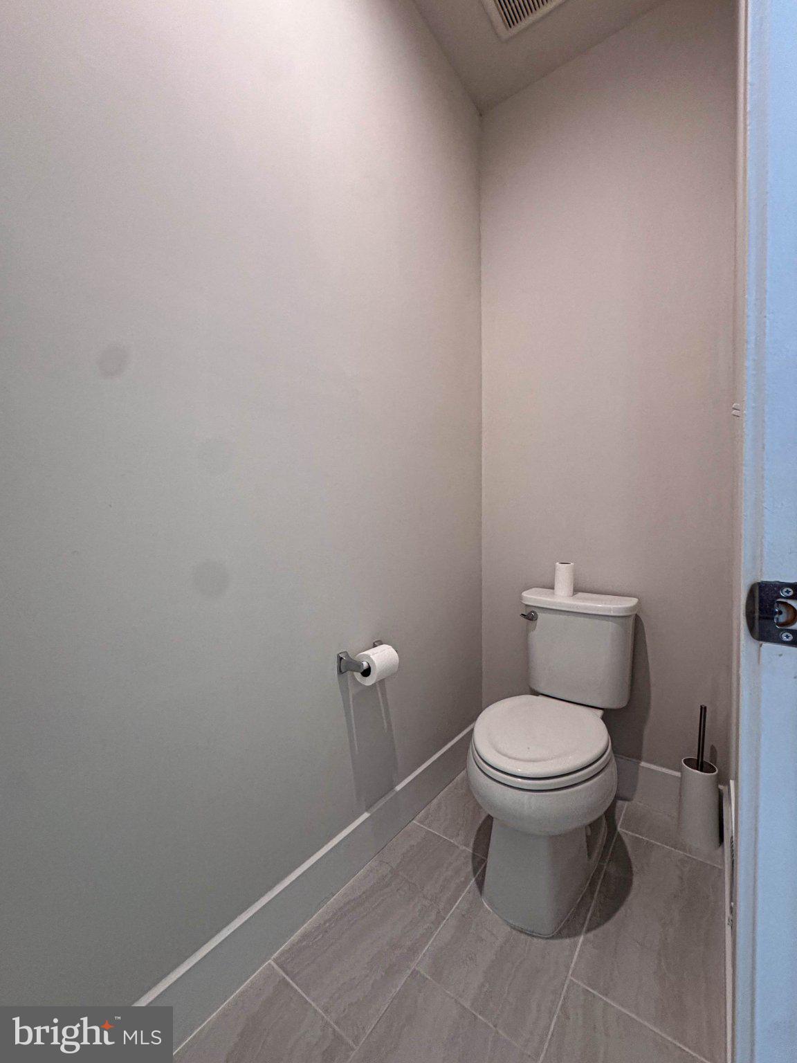2453 Liberty Loop Herndon, VA 20171 - Photo 17 of 52 a bathroom with a toilet