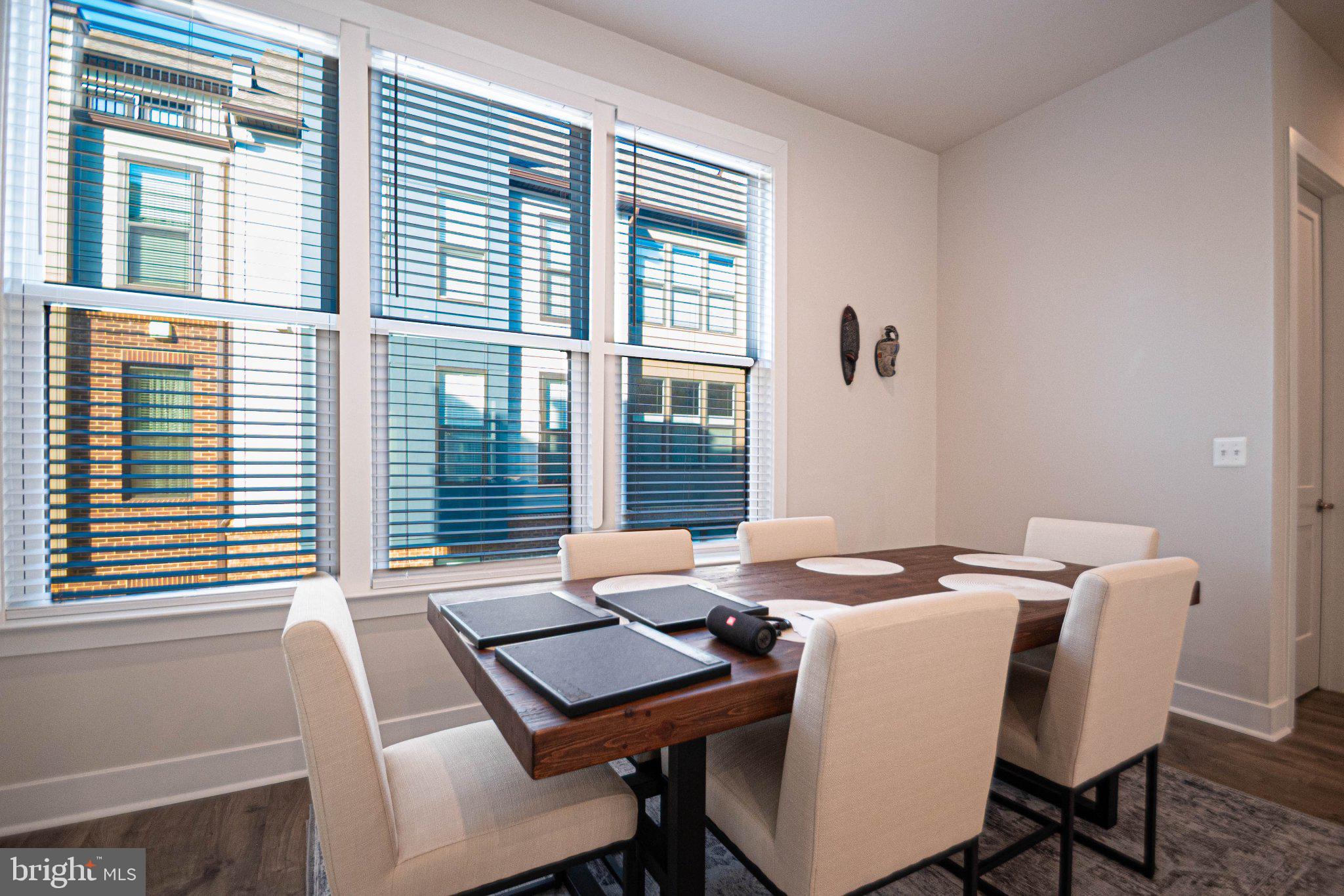 2453 Liberty Loop Herndon, VA 20171 - Photo 24 of 52 a view of a dining room with furniture and window