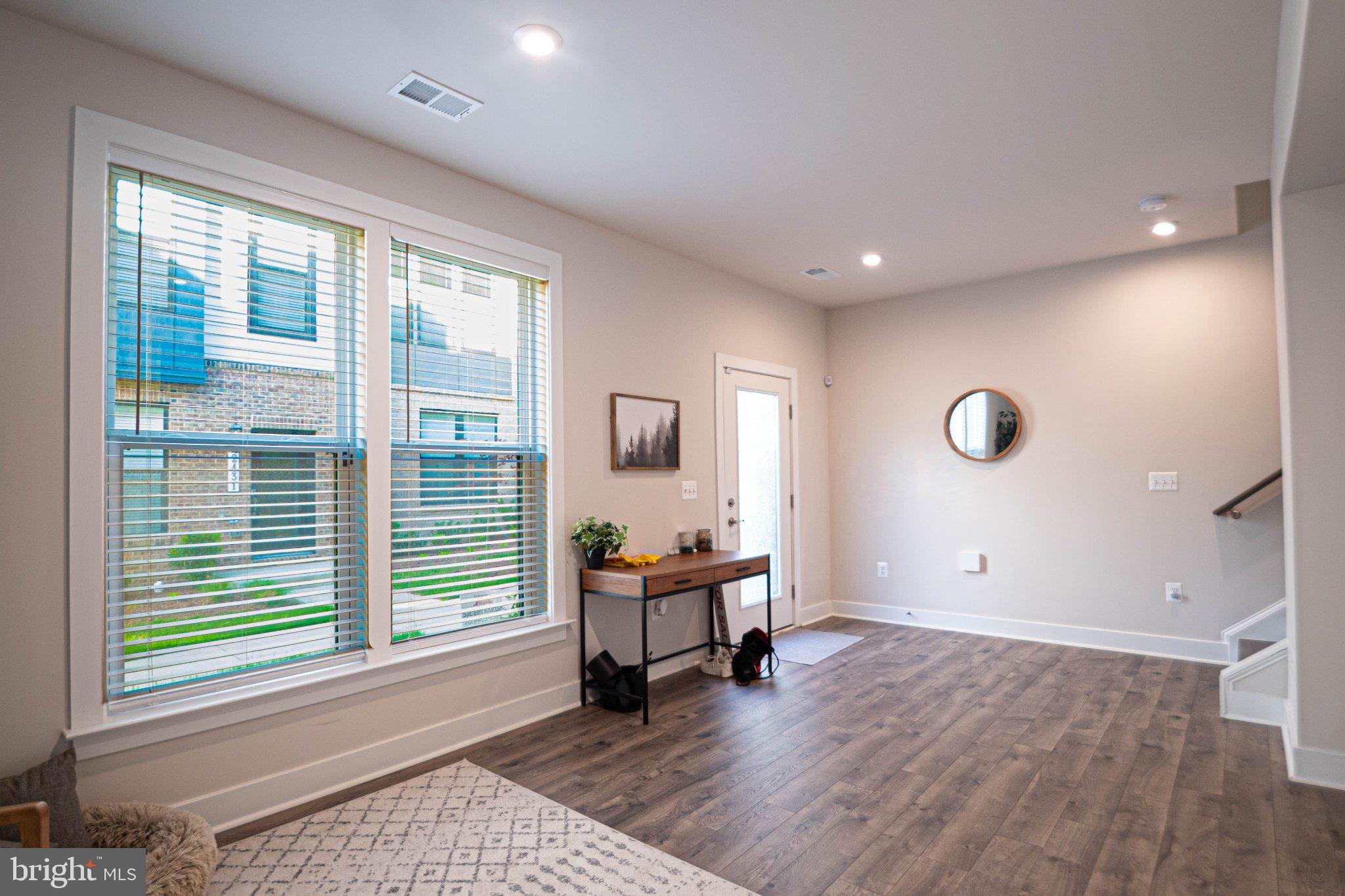 2453 Liberty Loop Herndon, VA 20171 - Photo 4 of 52 a view of a livingroom with workspace and a window