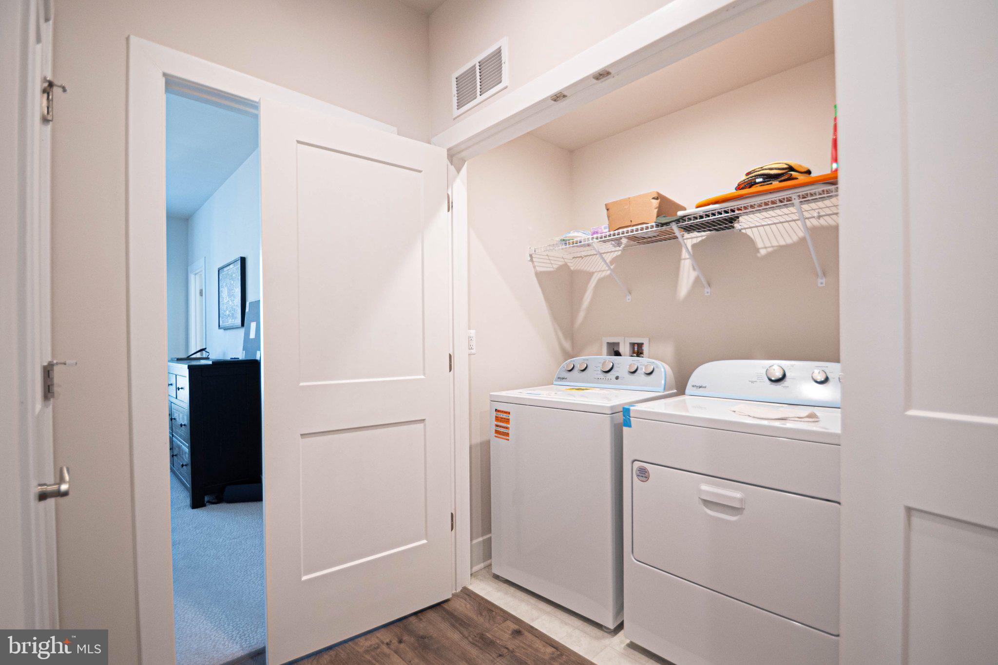 2453 Liberty Loop Herndon, VA 20171 - Photo 43 of 52 a view of storage room with washer and dryer