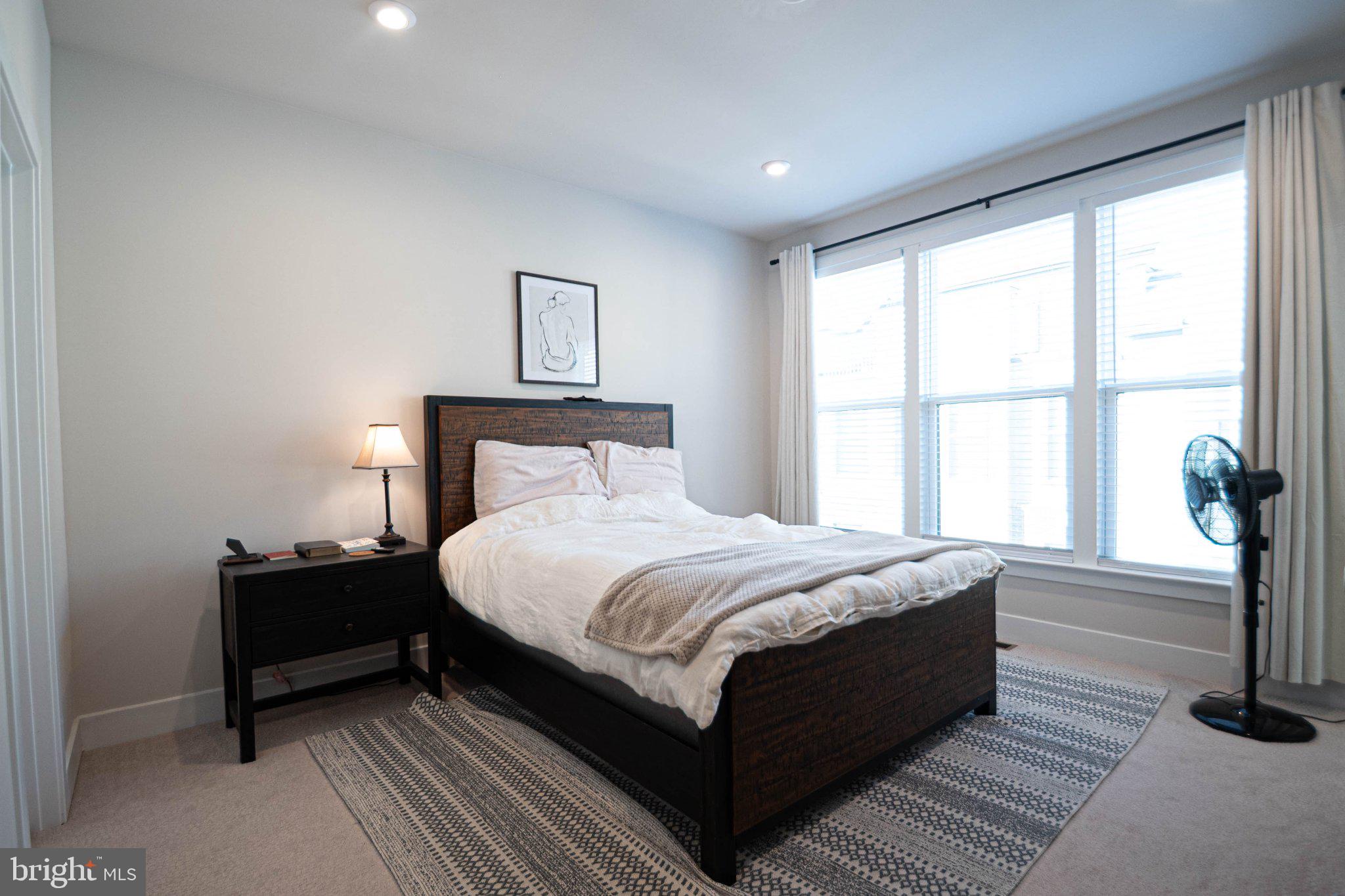 2453 Liberty Loop Herndon, VA 20171 - Photo 44 of 52 a bedroom with a bed and a window