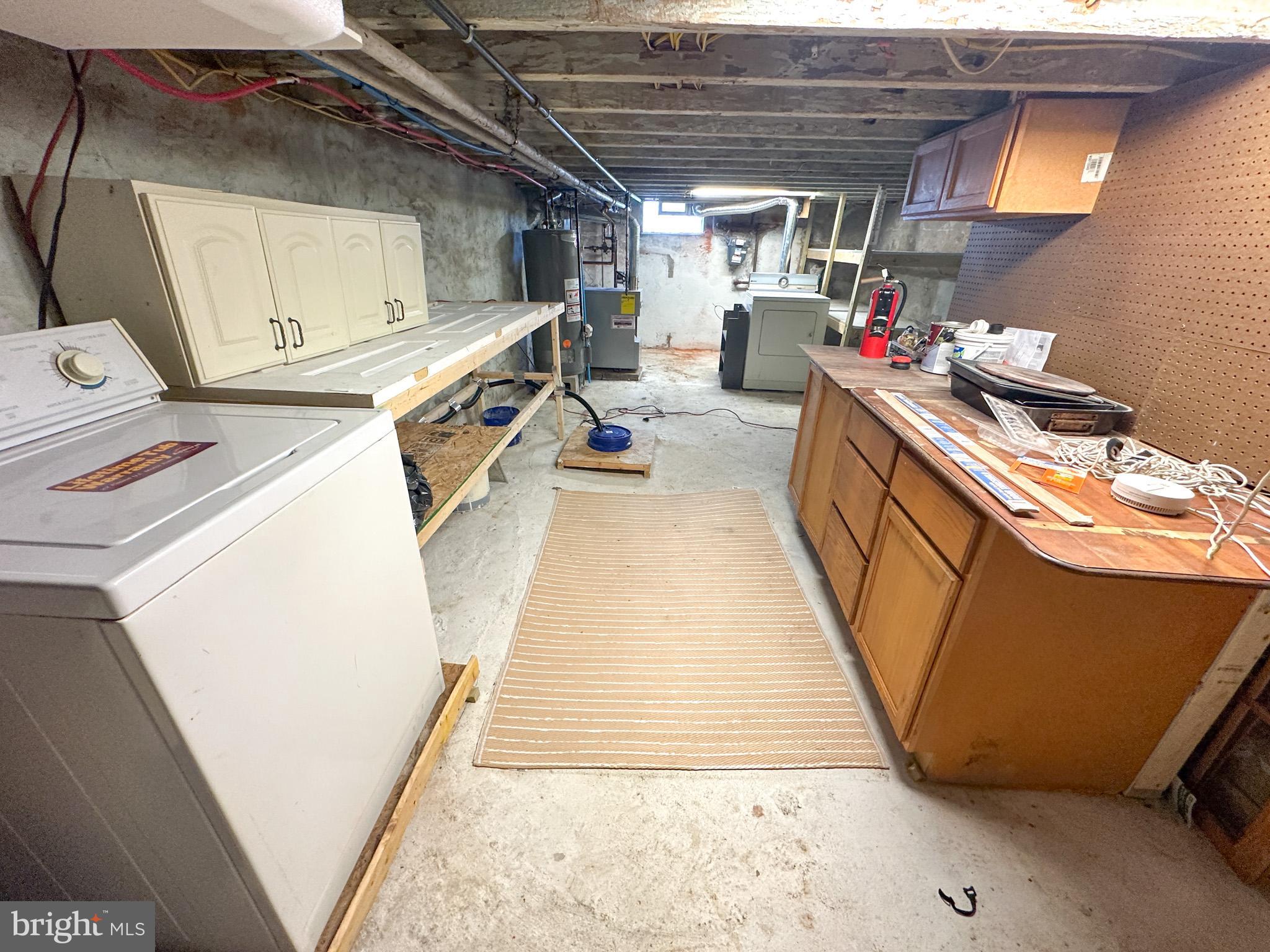 2834 East Venango Street Philadelphia, PA 19134 - Photo 12 of 14 a storage room with washer and dryer