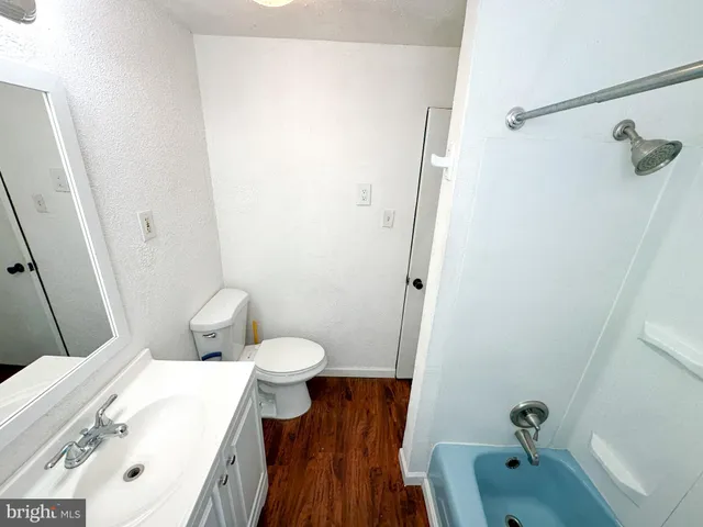 a bathroom with a sink and toilet
