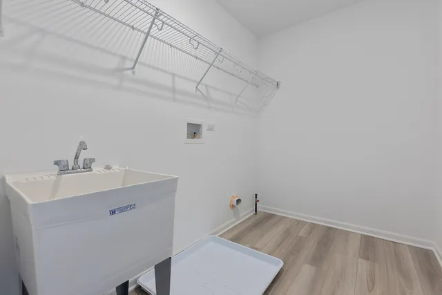 a view of a bathroom with a sink and mirror