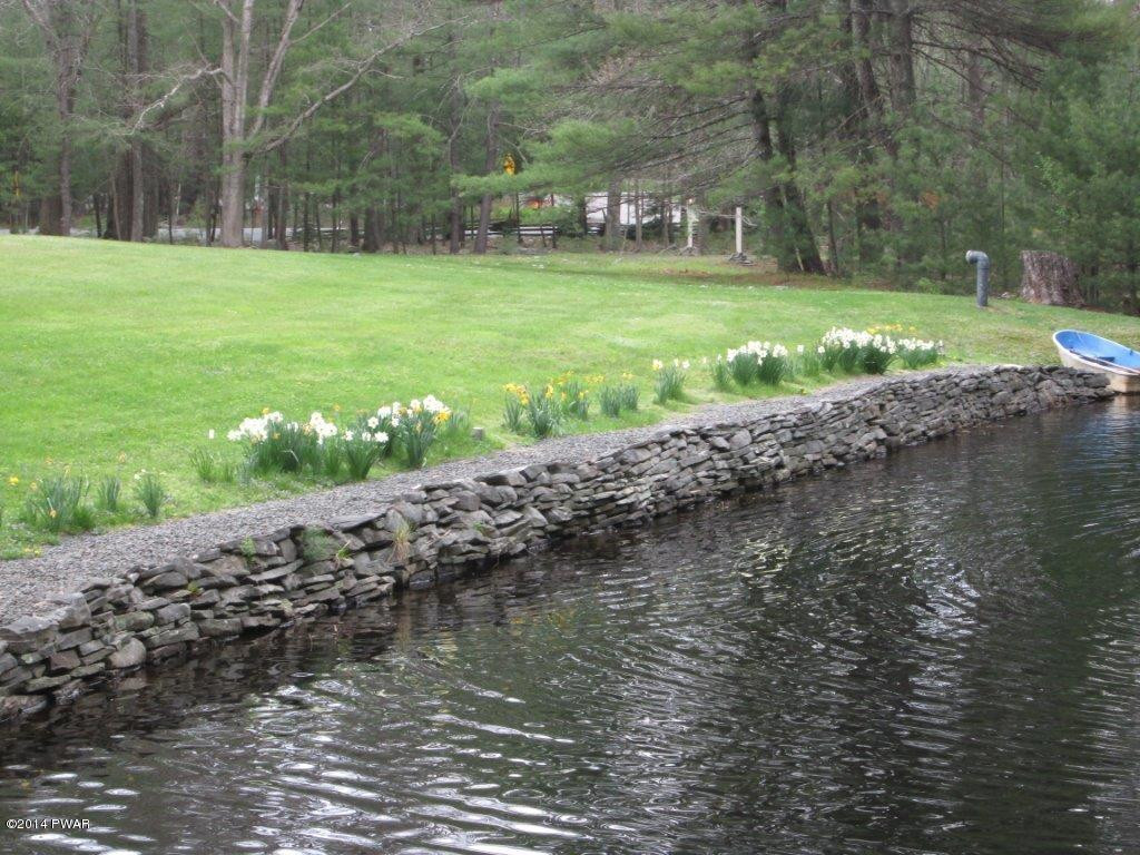 877 Welcome Lake Road Hawley, PA 18428 - Photo 56 of 78 STONE WALLS LINING POND