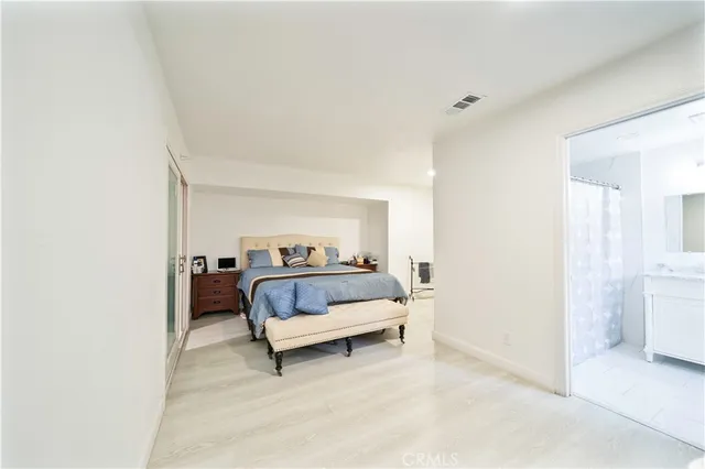 a bedroom with a bed and a closet