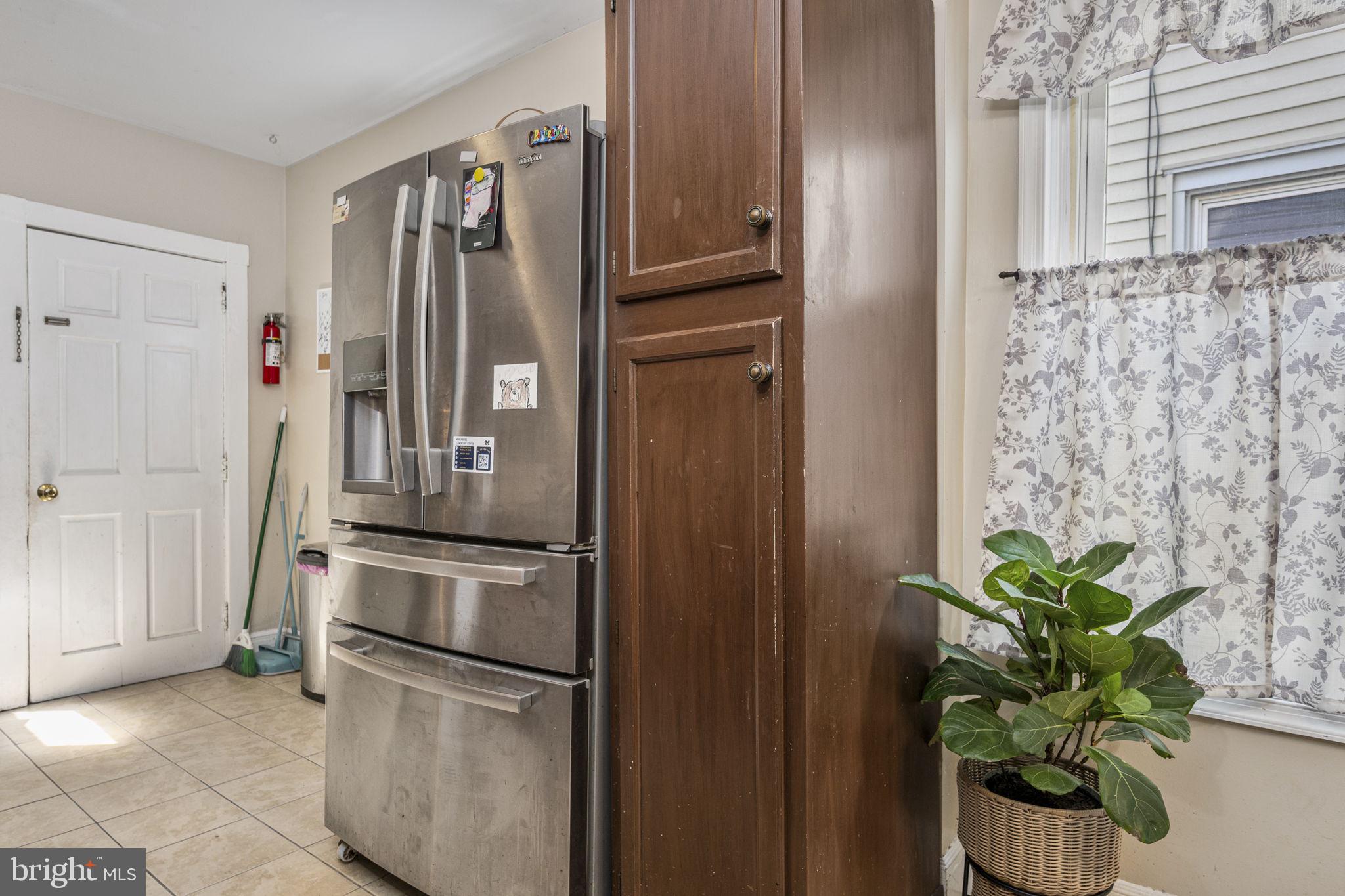 115 Park Avenue Reading, PA 19605 - Photo 11 of 28 a kitchen with stainless steel appliances a refrigerator and a window