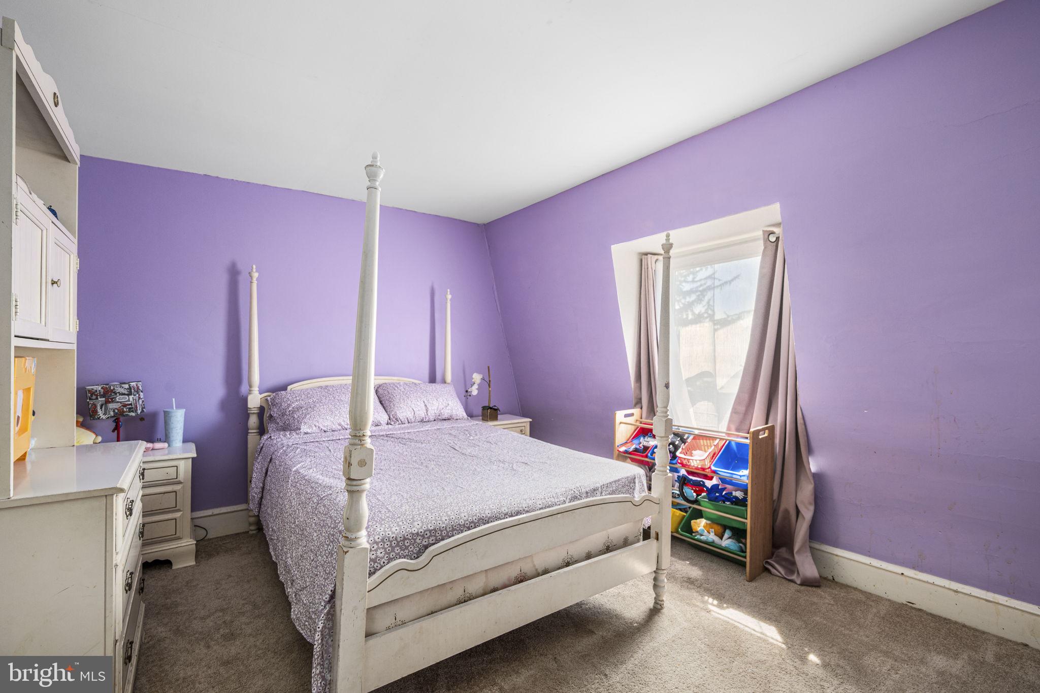 115 Park Avenue Reading, PA 19605 - Photo 16 of 28 a bed room with a bed and a mirror