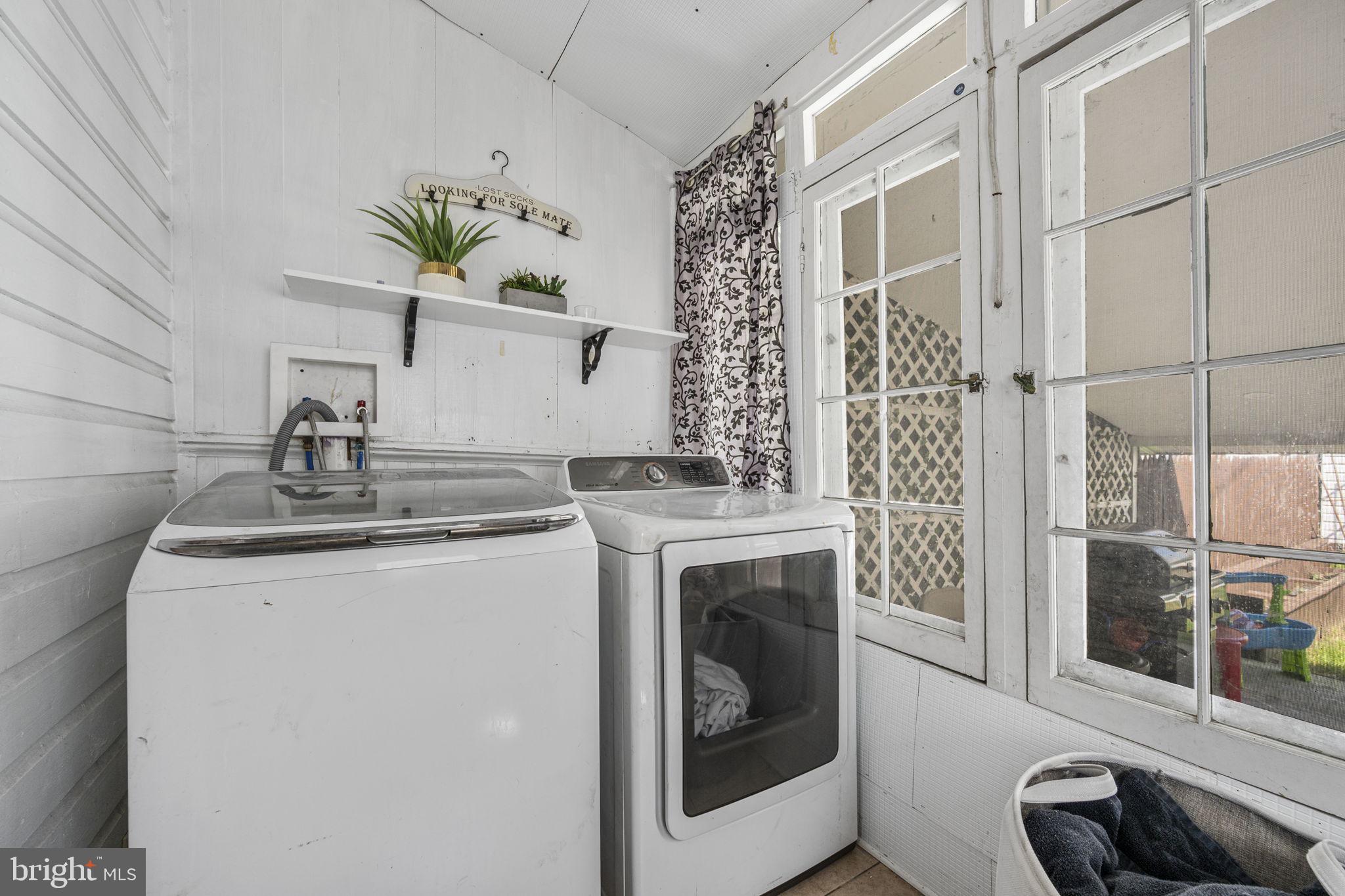 115 Park Avenue Reading, PA 19605 - Photo 21 of 28 a kitchen with a stove a sink and a refrigerator