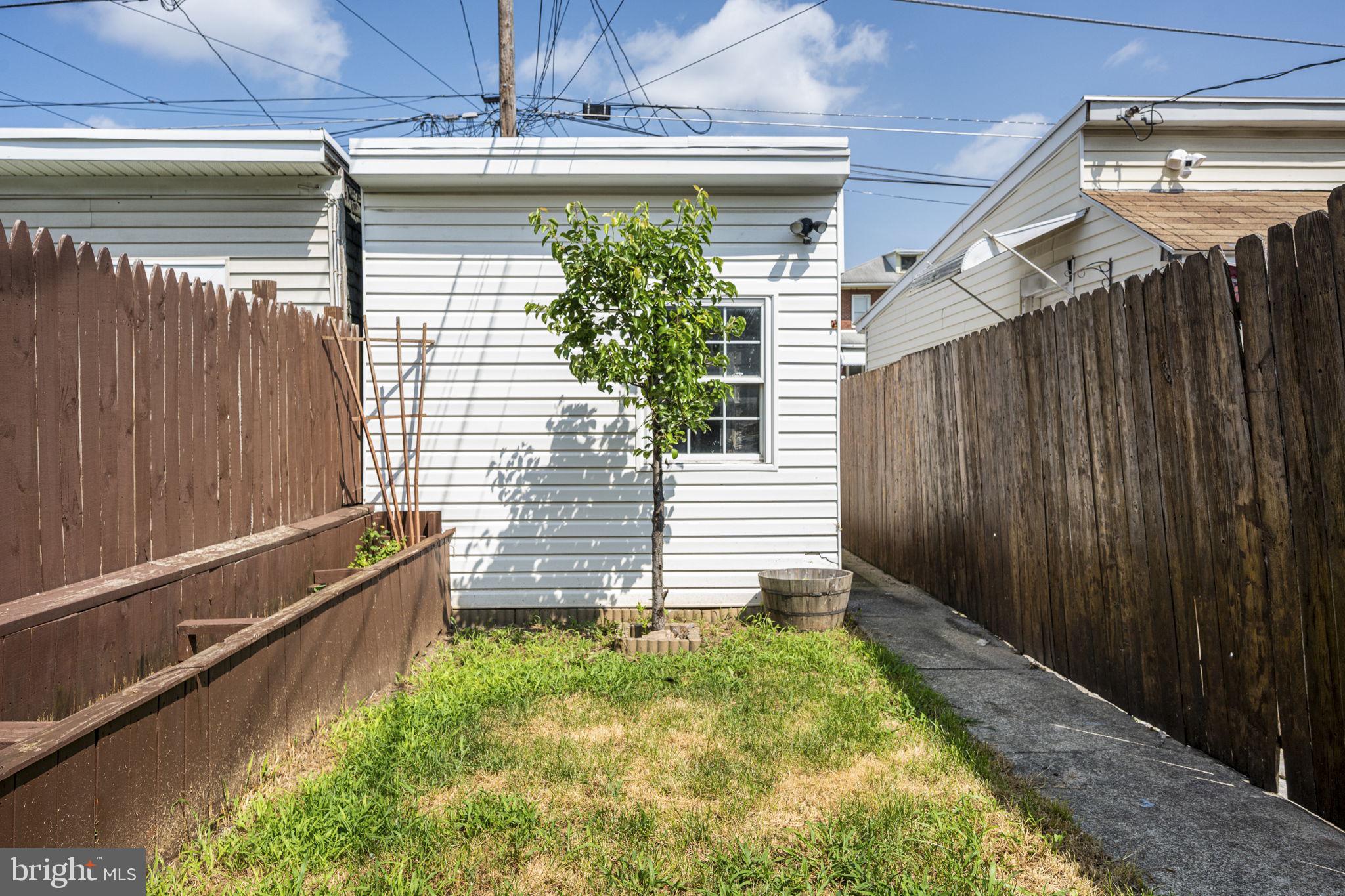 115 Park Avenue Reading, PA 19605 - Photo 23 of 28 a view of house with backyard and wooden fence