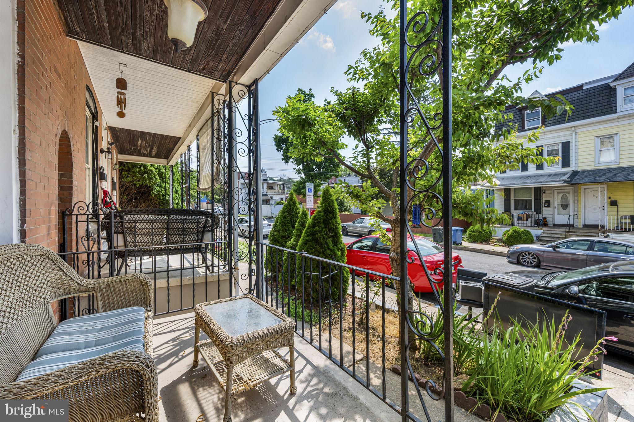 115 Park Avenue Reading, PA 19605 - Photo 3 of 28 a view of a patio with couches table and chairs and potted plants