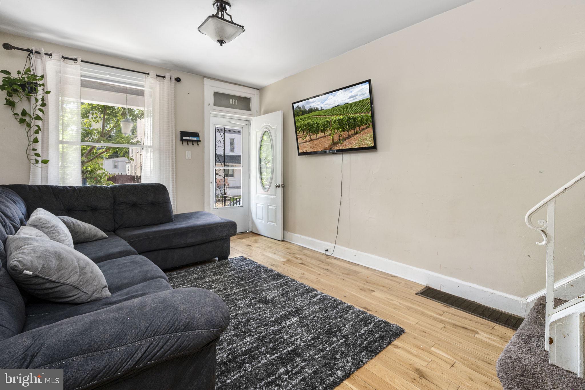 115 Park Avenue Reading, PA 19605 - Photo 4 of 28 a living room with furniture and a rug