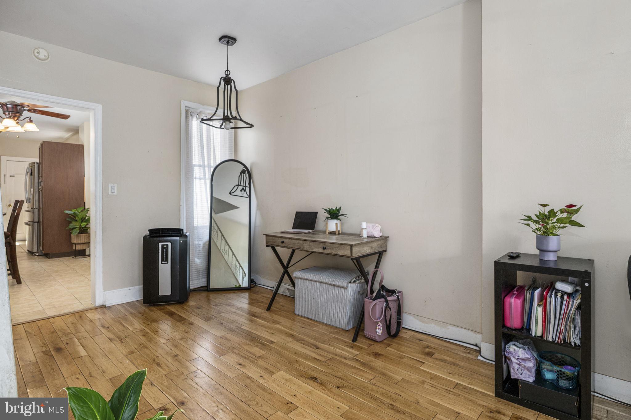 115 Park Avenue Reading, PA 19605 - Photo 6 of 28 a view of a workspace with furniture and wooden floor