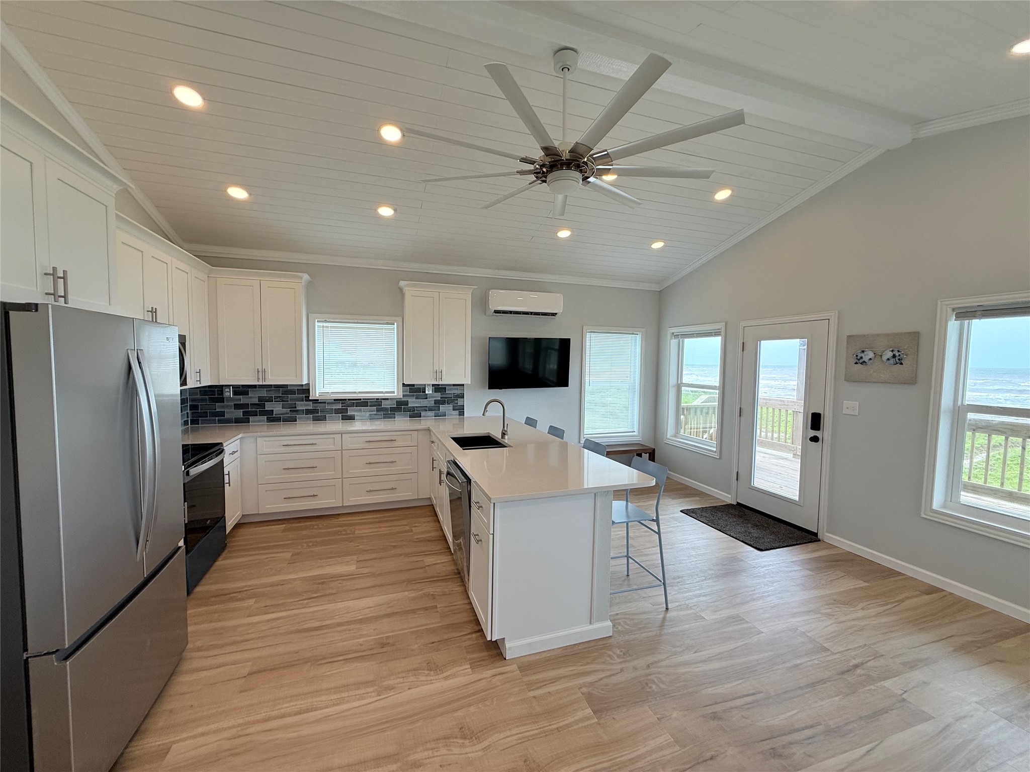 2154 County Road 230 Sargent, TX 77414 - Photo 17 of 30 a view of a kitchen with sink stainless steel appliances and window