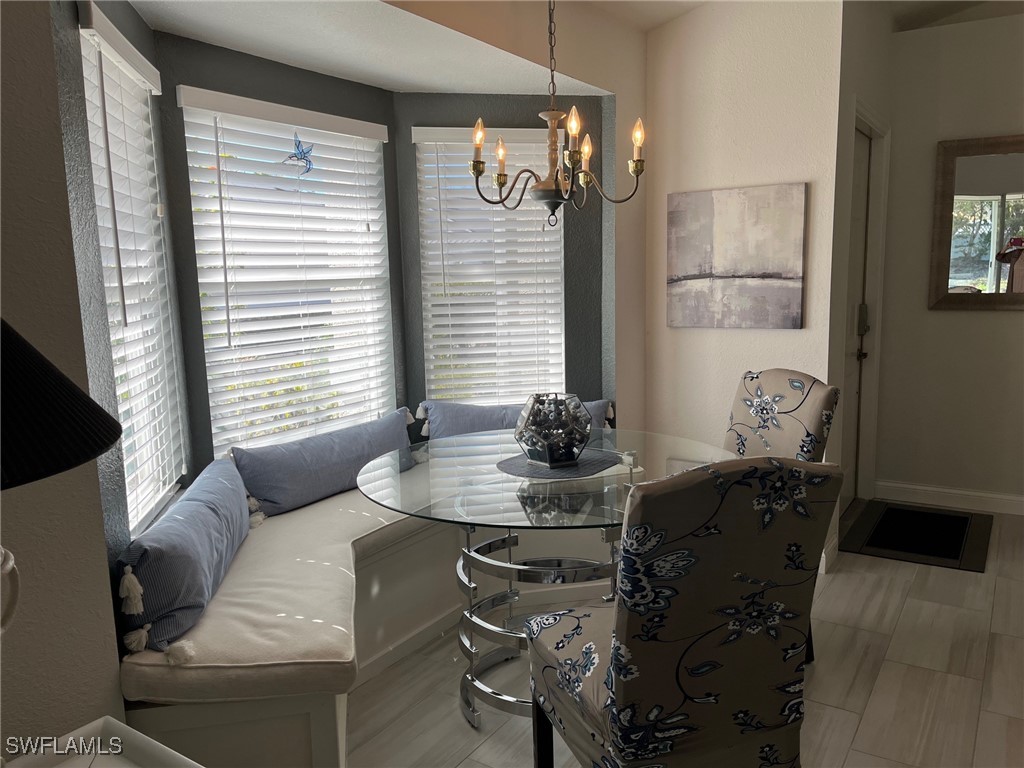 512 Islamorada Boulevard Punta Gorda, FL 33955 - Photo 11 of 46 a dining room with furniture and window