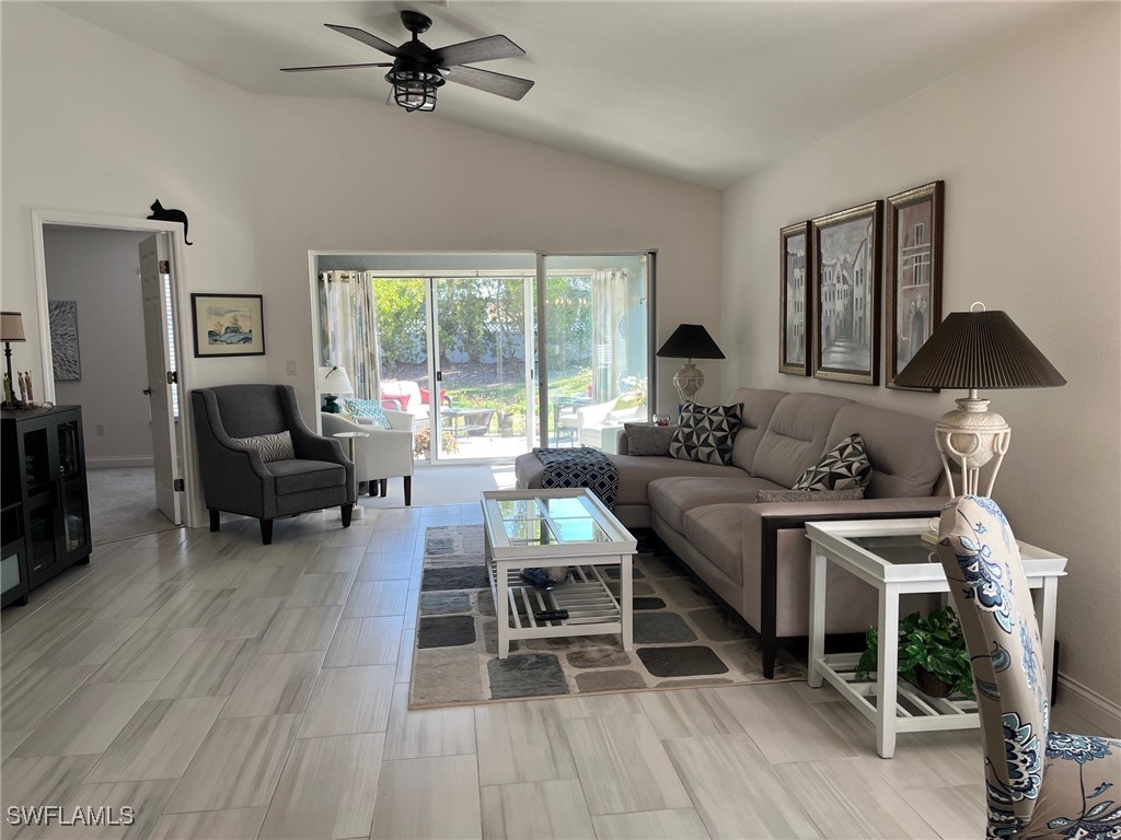 512 Islamorada Boulevard Punta Gorda, FL 33955 - Photo 13 of 46 a living room with furniture and a large window