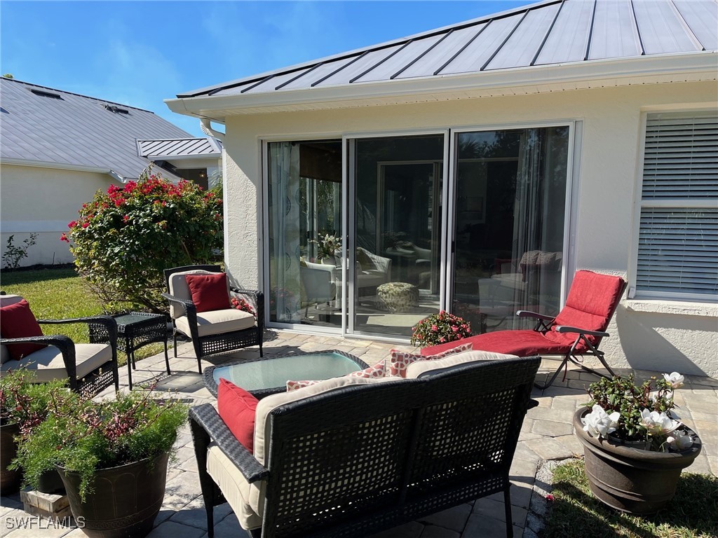 512 Islamorada Boulevard Punta Gorda, FL 33955 - Photo 21 of 46 a view of a patio with table and chairs and potted plants