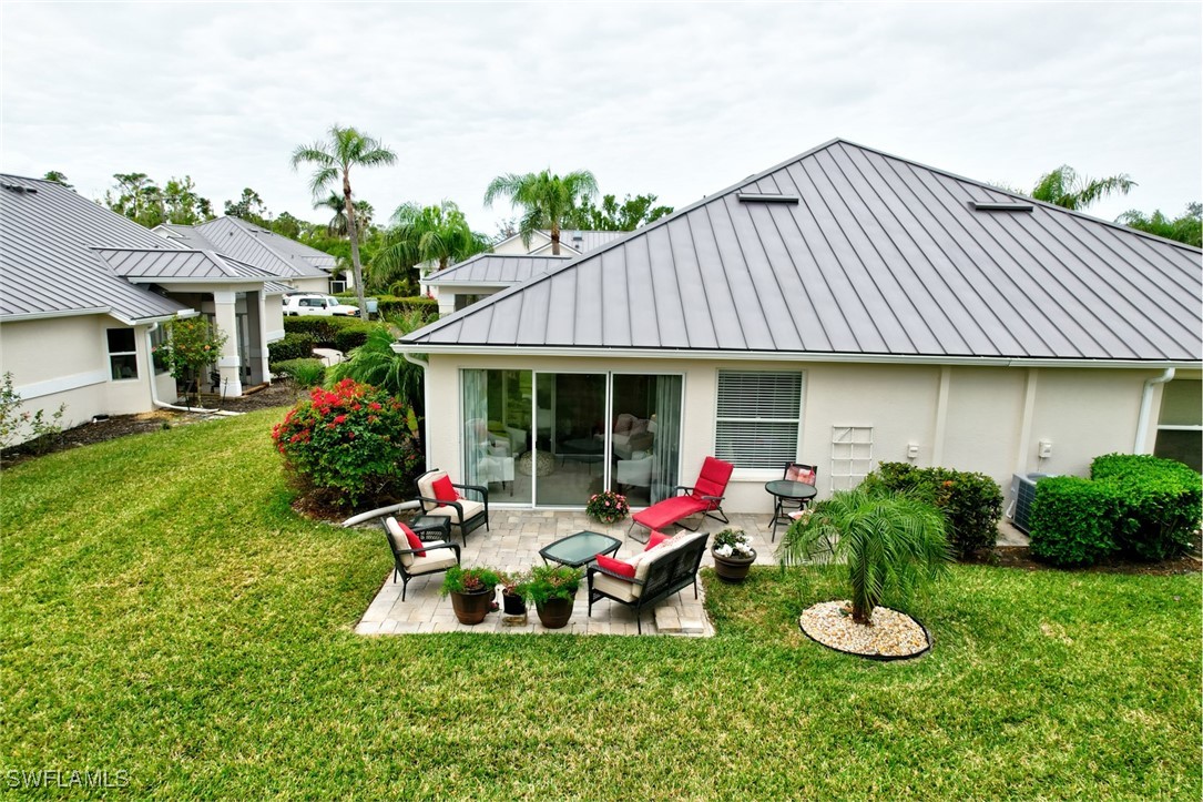 512 Islamorada Boulevard Punta Gorda, FL 33955 - Photo 22 of 46 a front view of a house with a porch and furniture